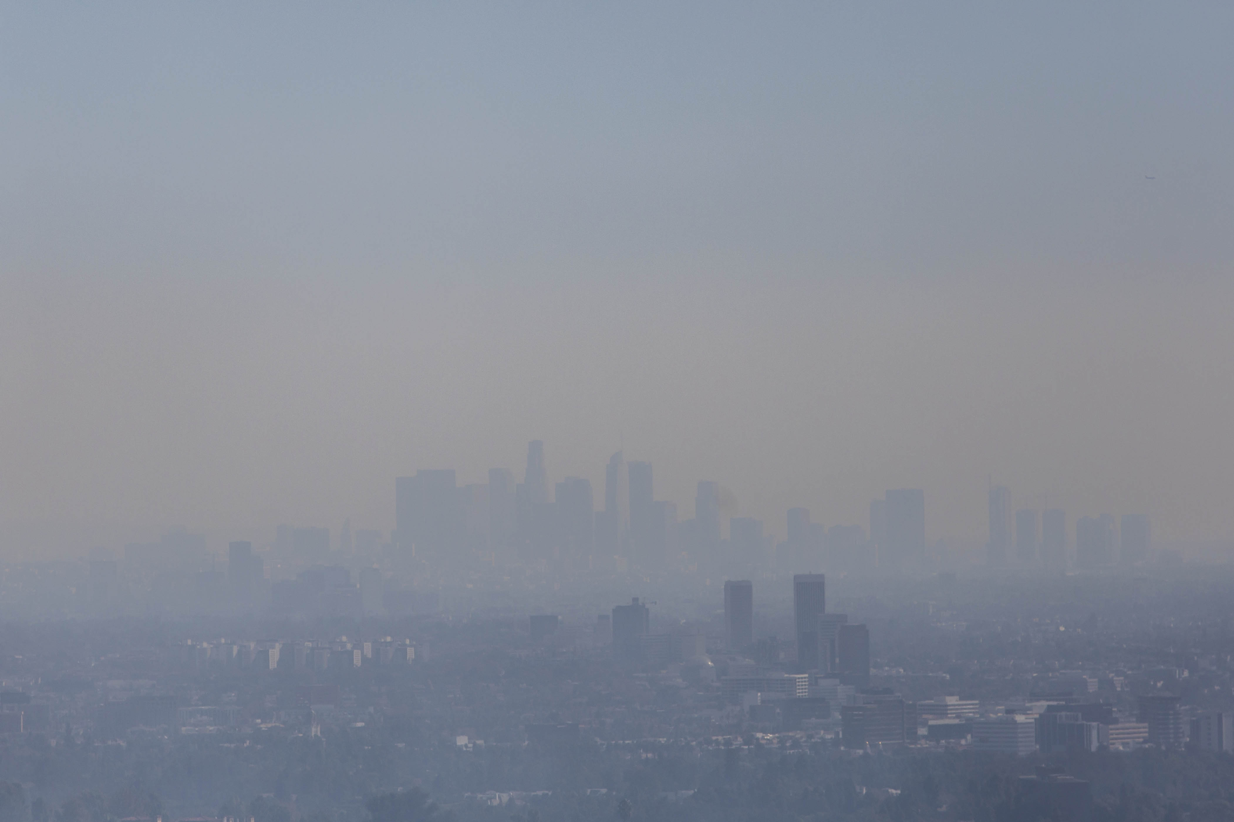 The Los Angeles skyline is seen through smoke as the Getty fire burns in the Brentwood area on Oct. 28, 2019. (Credit: APU GOMES/AFP via Getty Images)