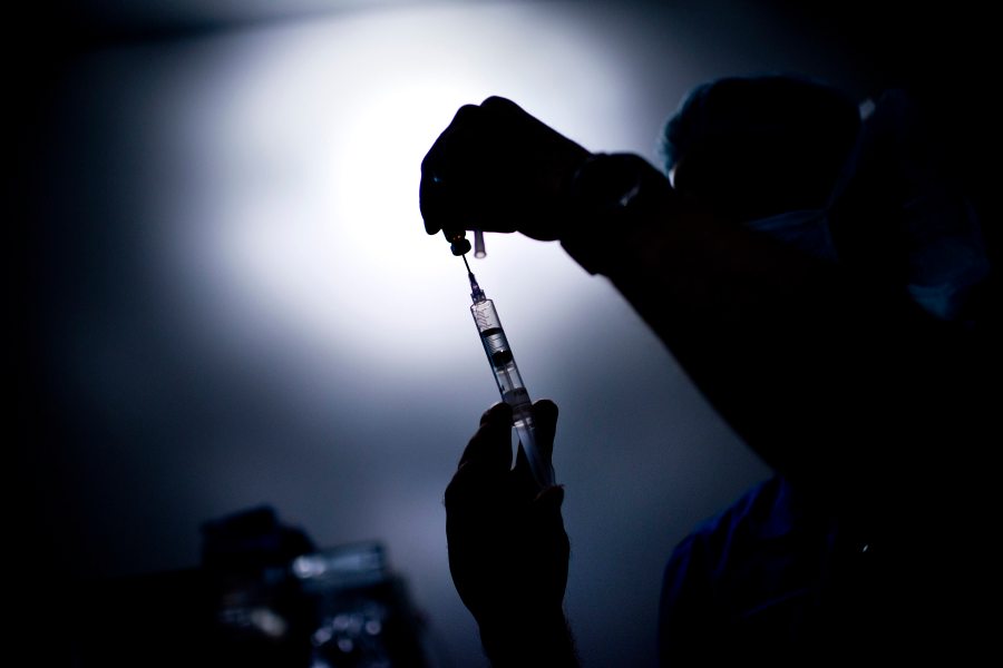 A doctor draws medicine into a syringe in this file photo. (Credit: BRENDAN SMIALOWSKI/AFP/GettyImages)