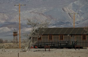 A replica of internment camp barracks sits near a watch tower at Manzanar National Historic Site on Dec. 9, 2015, near Independence, California. (Credit: Justin Sullivan/Getty Images)