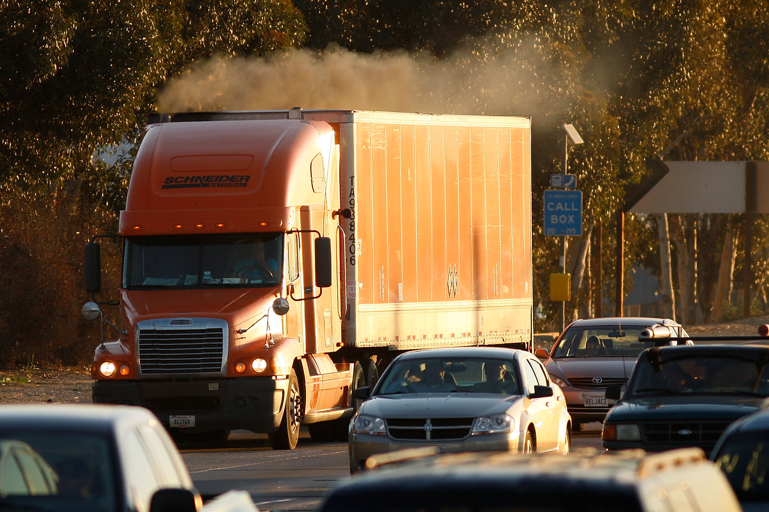 Diesel smoke spews from a truck as morning commuters travel the 210 freeway between Los Angeles and cities to the east on Dec. 1, 2009. (Credit: David McNew/Getty Images)