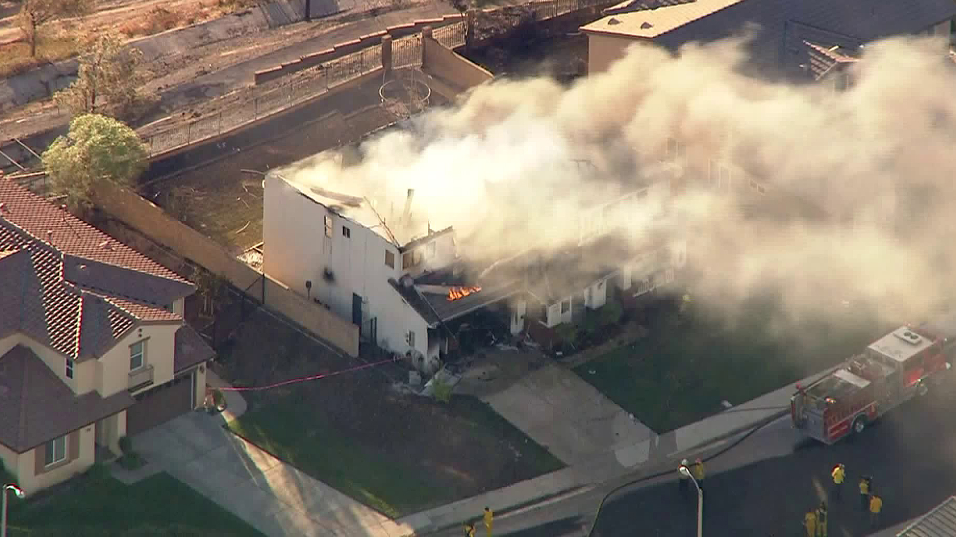 Embers from the Tick Fire burn a home in the Santa Clarita area on Oct. 25, 2019. (Credit: KTLA)