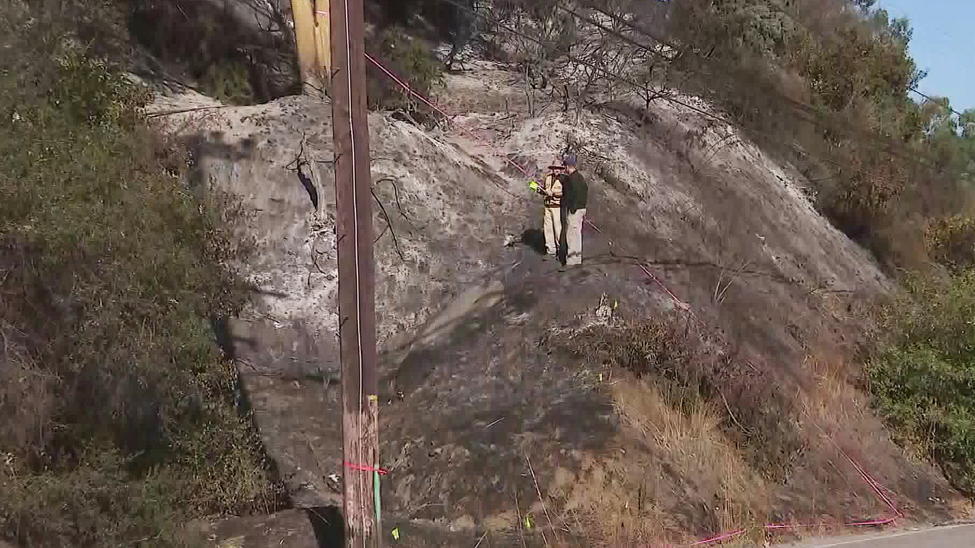 Getty Fire investigators focus on a power pole in the Sepulveda Pass on Oct. 29, 2019. (Credit: KTLA)