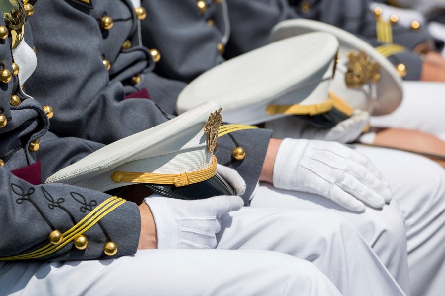 West Point cadets hold their caps on their laps during graduation ceremonies at the United States Military Academy, Saturday, May 25, 2019, in West Point, N.Y. (Credit: Julius Motal/AP via CNN Wire)