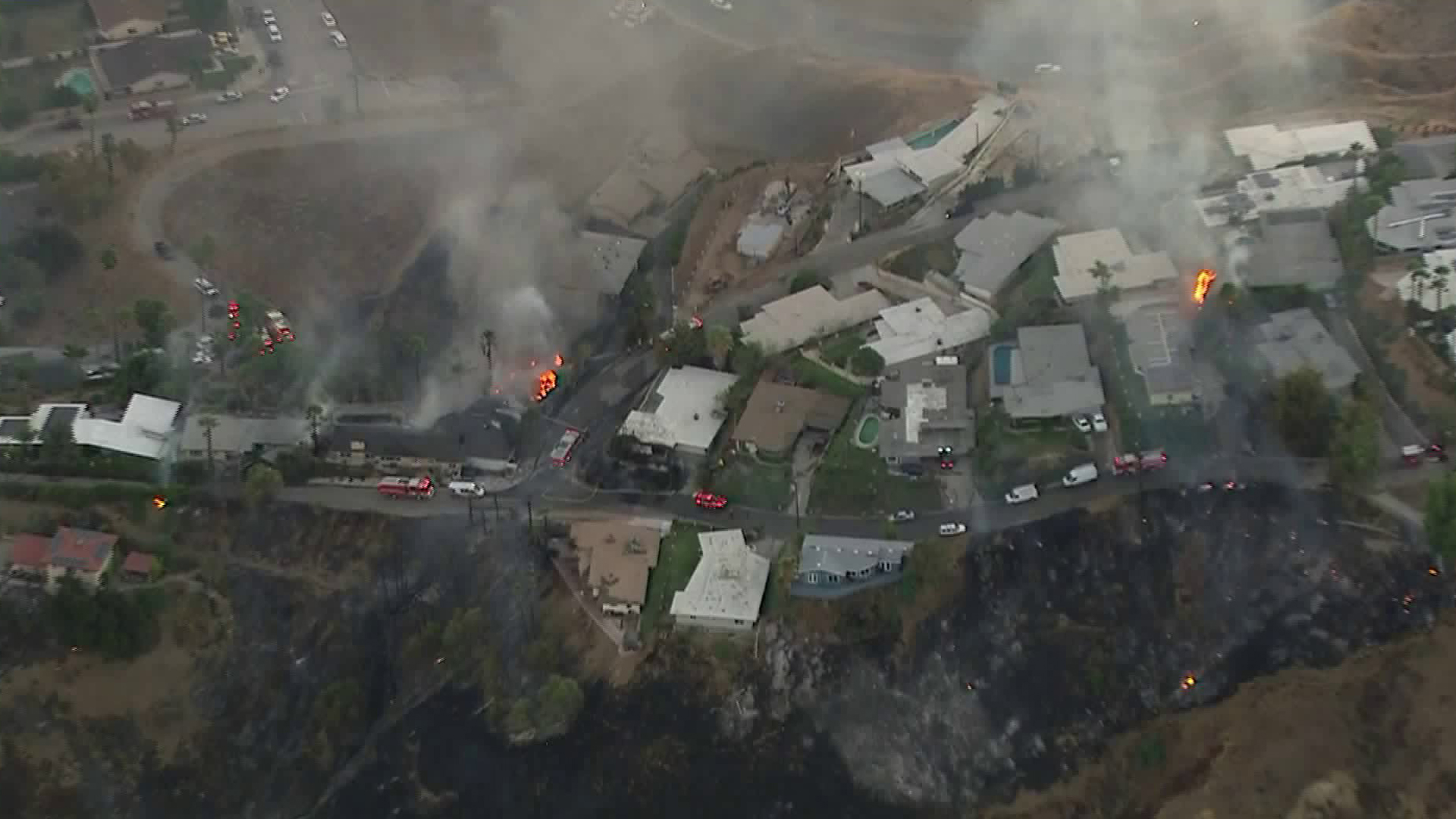 At least two homes burn during the Little Mountain Fire in San Bernardino on Oct. 21, 2019. (Credit: KTLA)