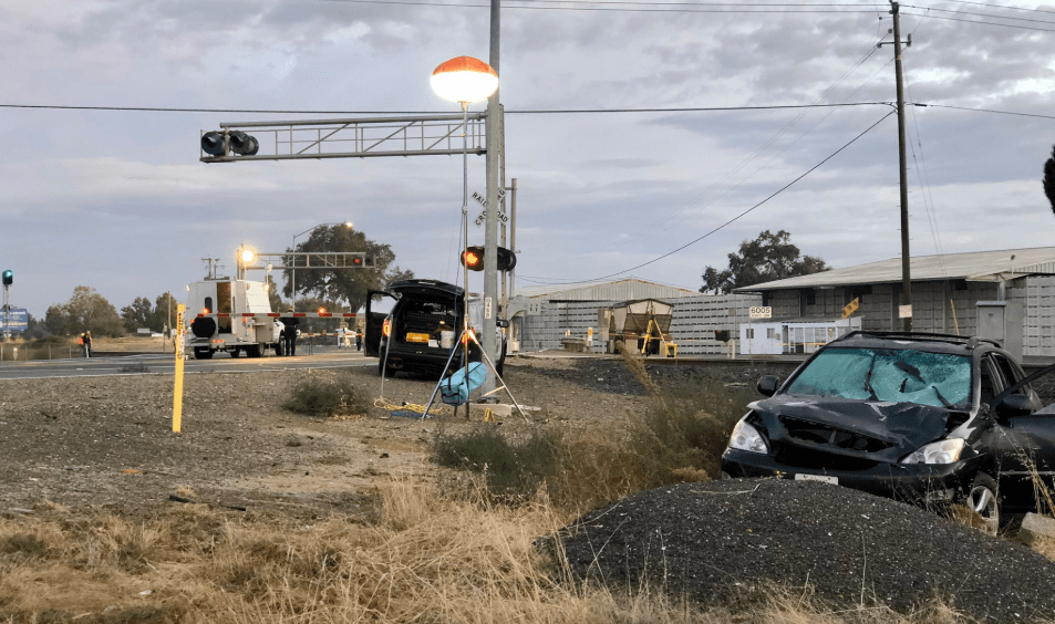 The scene after a California Highway Patrol officer was hit by a car near railroad crossing gates north of Live Oak on Oct. 19, 2019. (Credit: CHP)