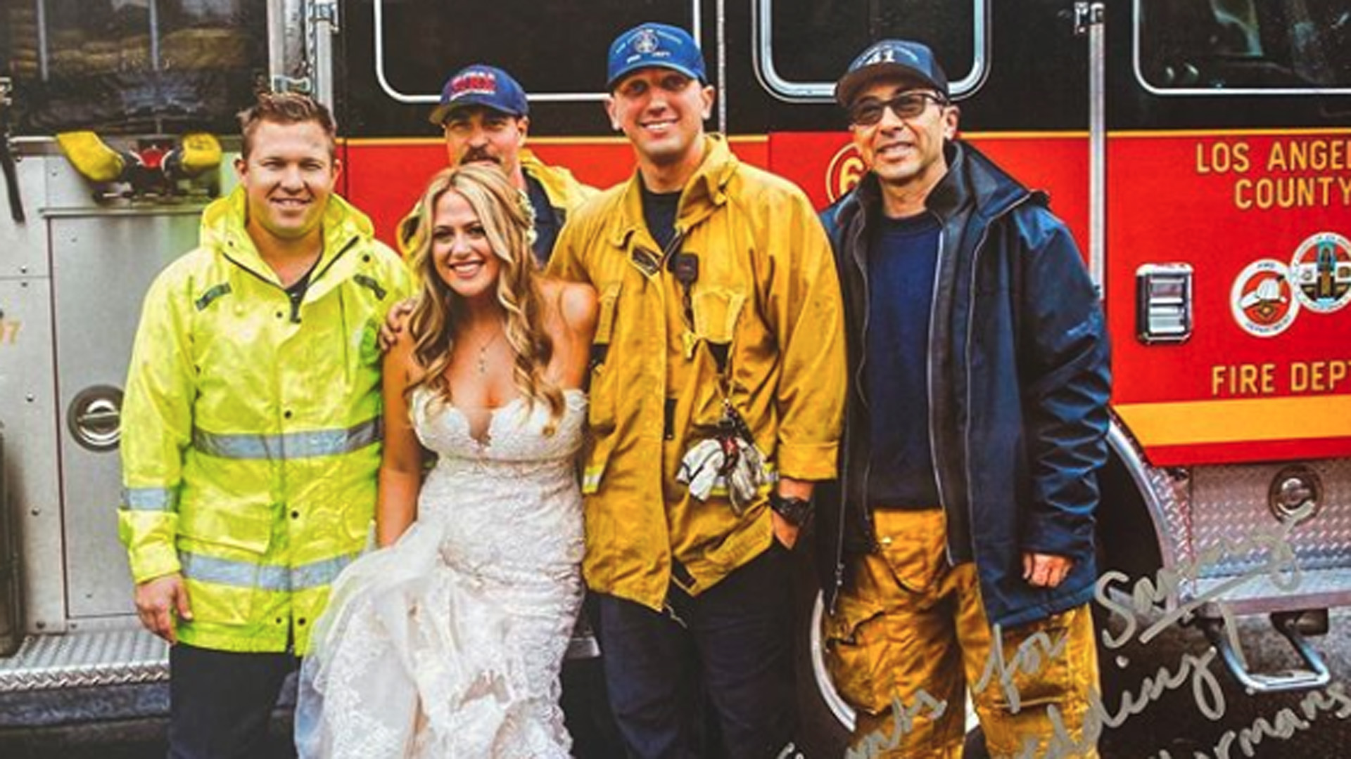 L.A. County firefighters and a bride they escorted to her wedding are seen in a photo posted by the department on Nov. 16, 2019.