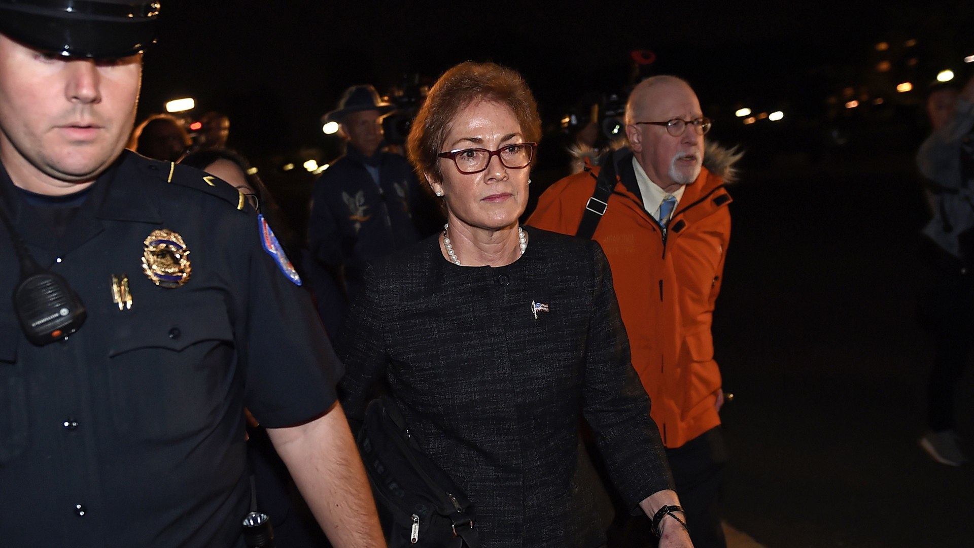 Former US Ambassador to Ukraine Marie Yovanovitch (C) flanked by lawyers, aides and Capitol police, leaves the US Capitol October 11, 2019 in Washington, DC after testifying behind closed doors to the House Intelligence, Foreign Affairs and Oversight committees as part of the ongoing impeachment investigation against President Donald Trump. (Credit: Olivier Douliery/AFP/Getty Images)