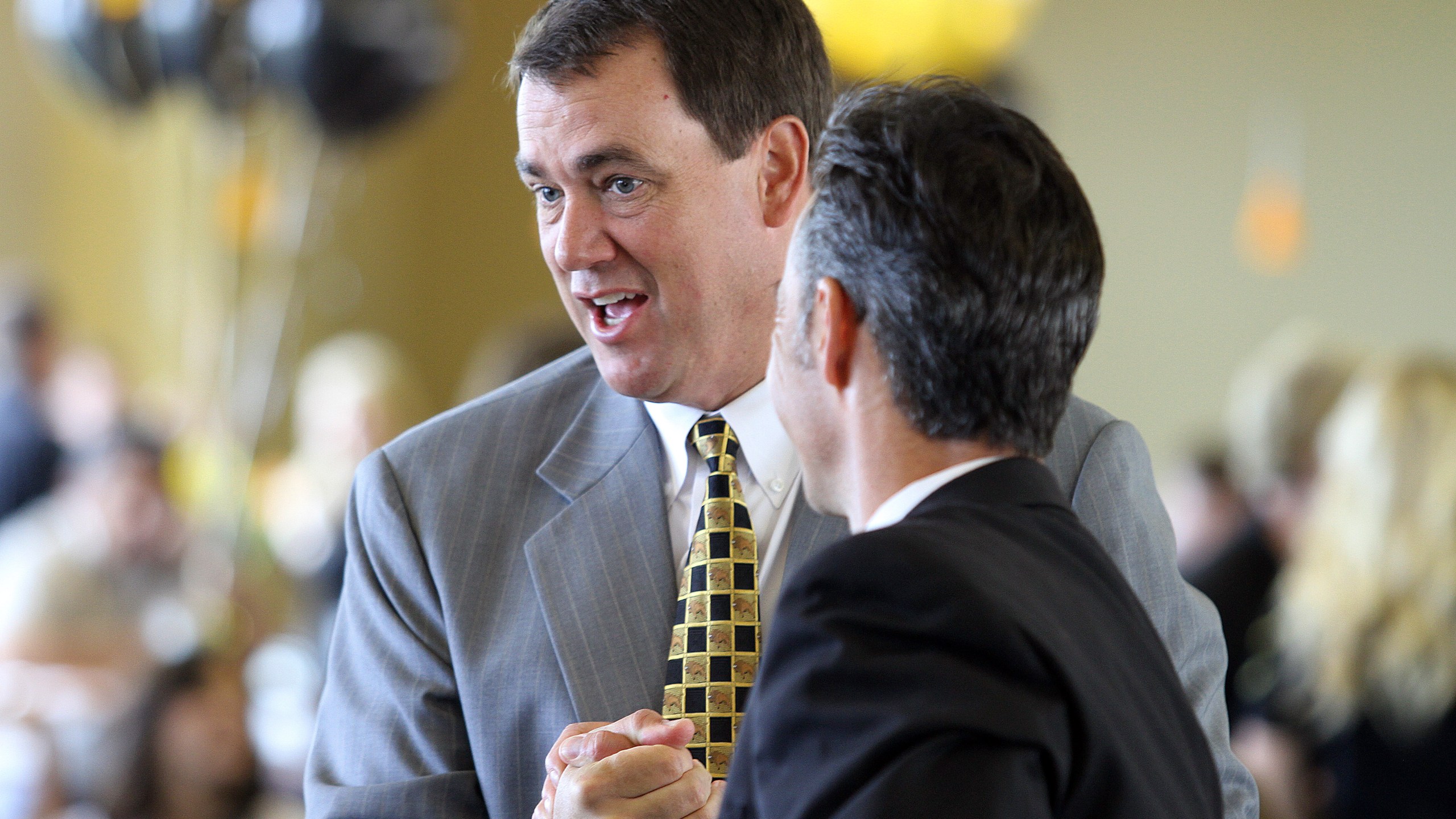 Mike Bohn, left, is seen at Folsom Stadium in Boulder while serving as the University of Colorado’s athletic director on June 11, 2010. (Credit: Marc Piscotty/Getty Images)