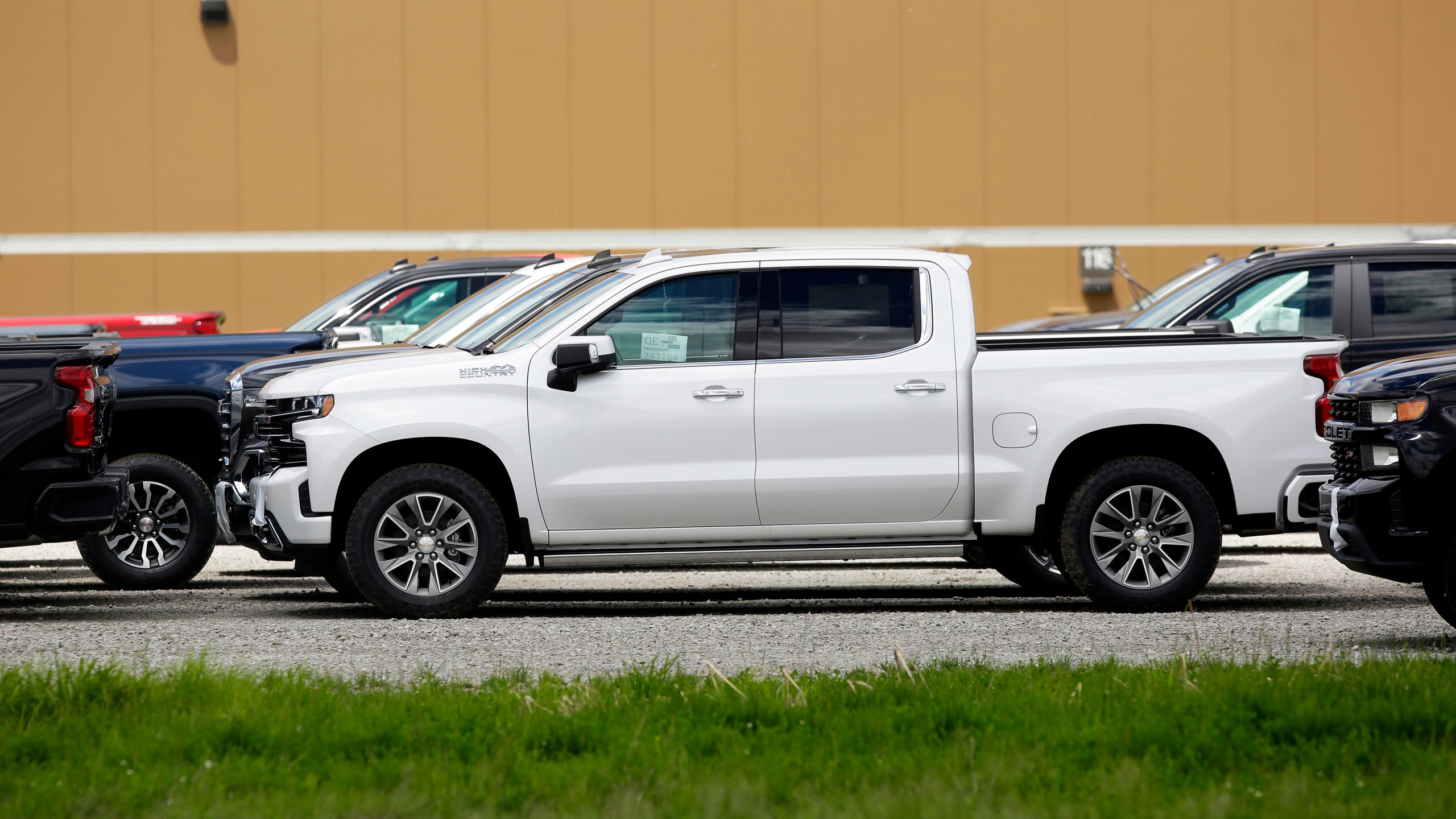 Chevrolet pickup trucks sit in a parking lot outside the GM Fort Wayne Assembly Plant on May 30, 2019 in Roanoke, Indiana. (Credit: Joshua Lott/Getty Images)