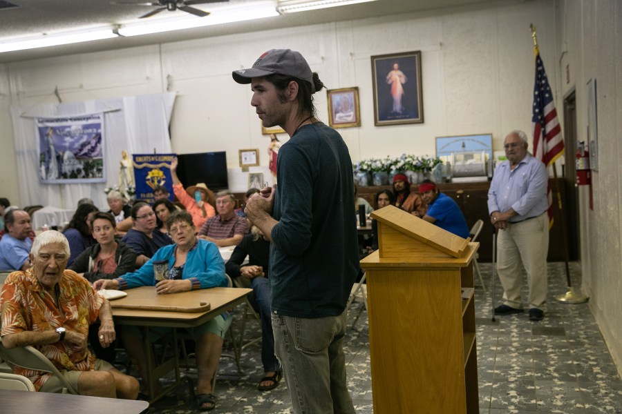 Scott Warren, a volunteer for the humanitarian aid organization No More Deaths, speaks with local residents during a community meeting to discuss federal charges against him for providing food and shelter to undocumented immigrants on May 10, 2019, in Ajo, Ariz. Warren was scheduled to appear in court for felony charges on May 29, in Tucson, accused by the U.S. government on two counts of harboring and one count of conspiracy for providing food, water, and beds to two Central American immigrants in January 2018. If found guilty, Warren could face up to 20 years in prison. (Credit: John Moore/Getty Images)