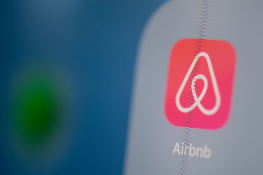 This illustration picture taken on July 24, 2019, in Paris shows the Airbnb logo on the screen of a tablet. (Credit: MARTIN BUREAU/AFP via Getty Images)