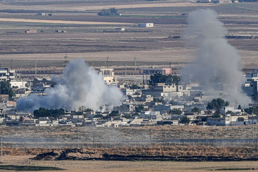 This picture taken on Oct. 15, 2019, from the Turkish side of the border at Ceylanpinar district in Sanliurfa shows smoke rising from the Syrian town of Ras al-Ain on the first week of Turkey's military operation against Kurdish forces. (Credit: OZAN KOSE/AFP via Getty Images)