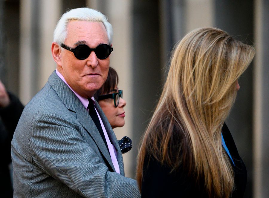 Roger Stone enters the E. Barrett Prettyman U.S. Court House with his wife Nydia, center, and daughter Adria Stone, right, on Nove. 5, 2019 in Washington, D.C. (Credit: ANDREW CABALLERO-REYNOLDS/AFP via Getty Images)