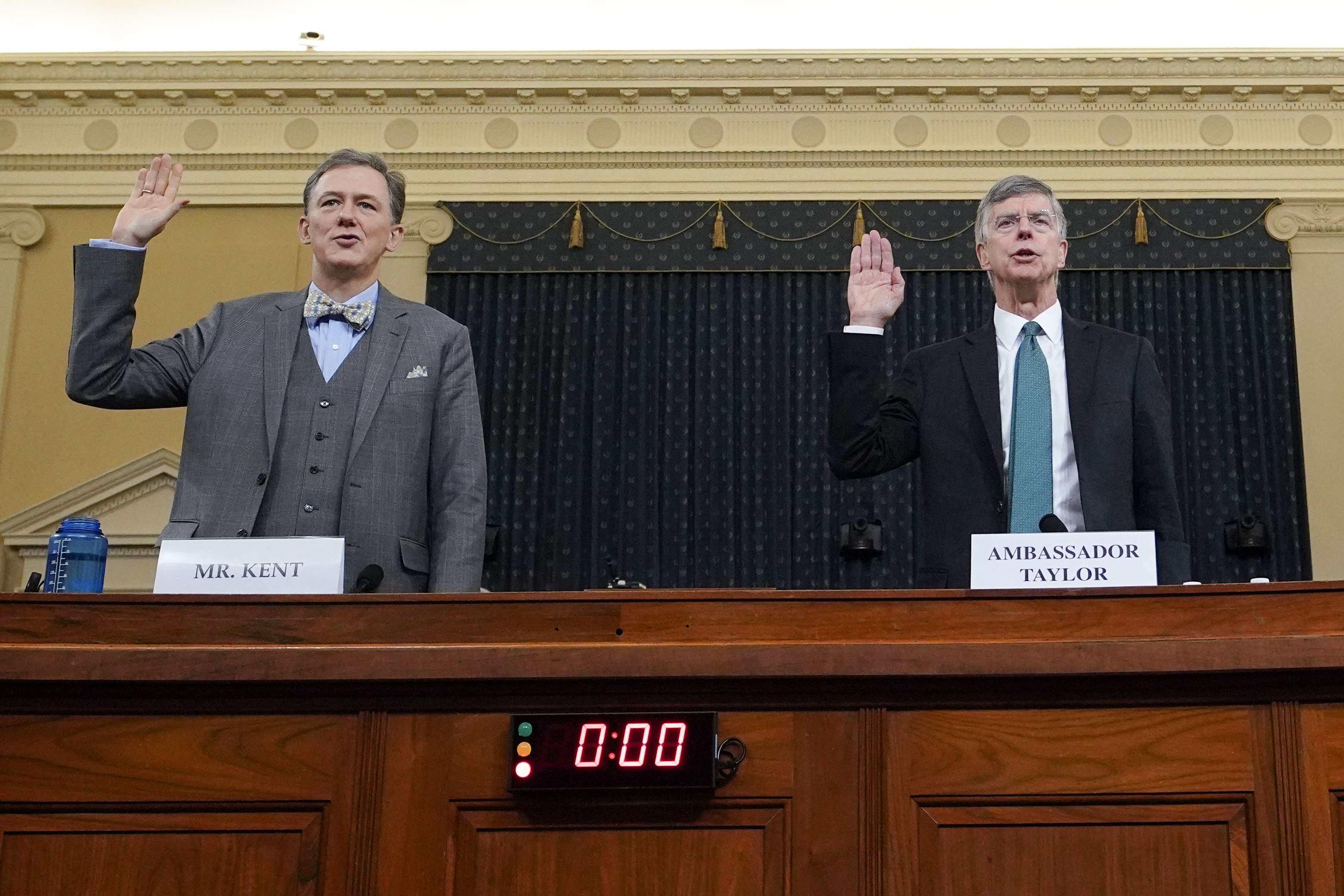 Deputy Assistant Secretary for European and Eurasian Affairs George P. Kent and top U.S. diplomat in Ukraine William B. Taylor Jr. are sworn-in prior to testifying before the House Intelligence Committee on Capitol Hill November 13, 2019 in Washington, DC. (Credit: Joshua Roberts - Pool/Getty Images)