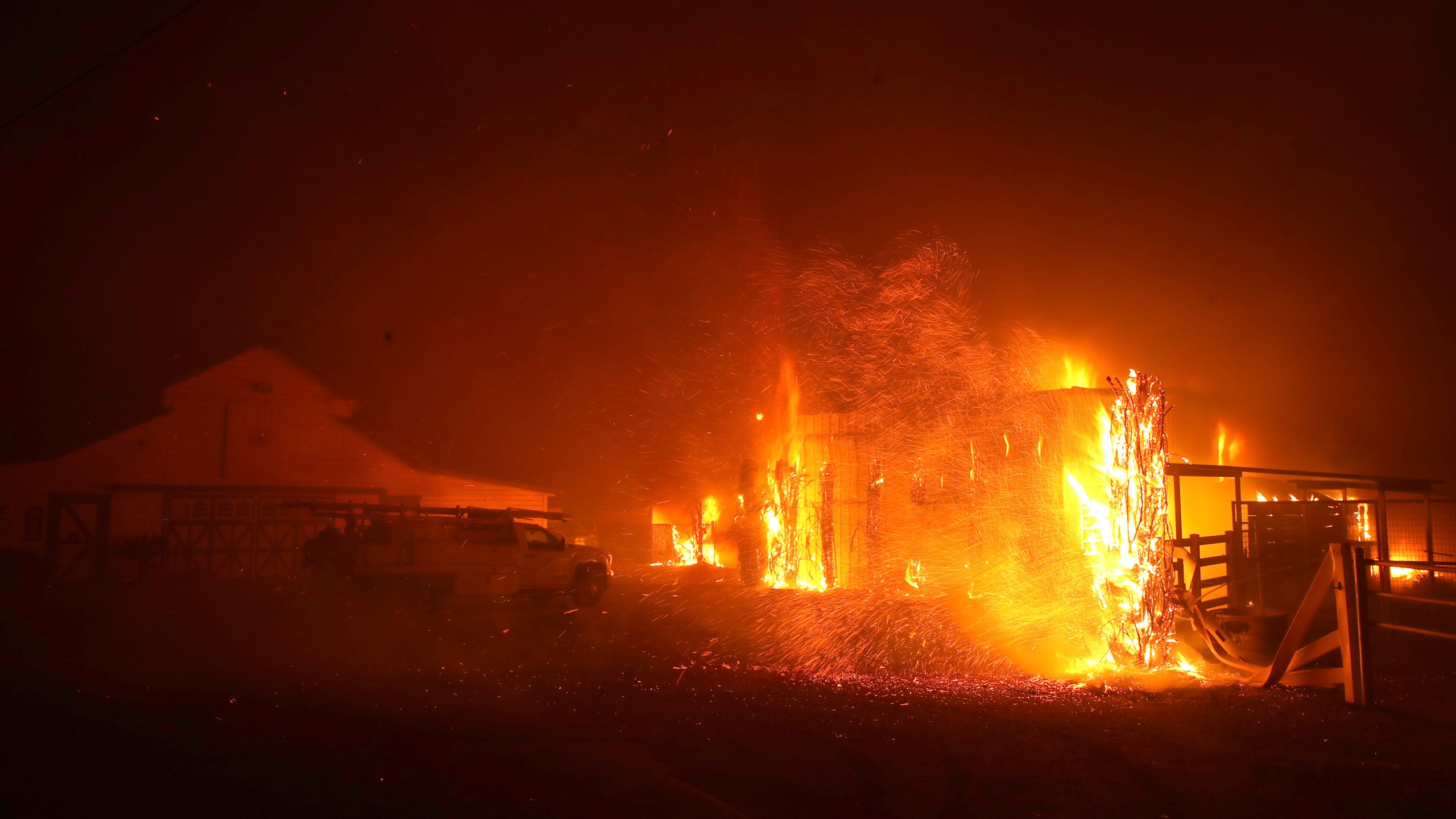 The Kincade Fire burns a structure on Oct. 27, 2019, in Santa Rosa, California. (Credit: Justin Sullivan/Getty Images)