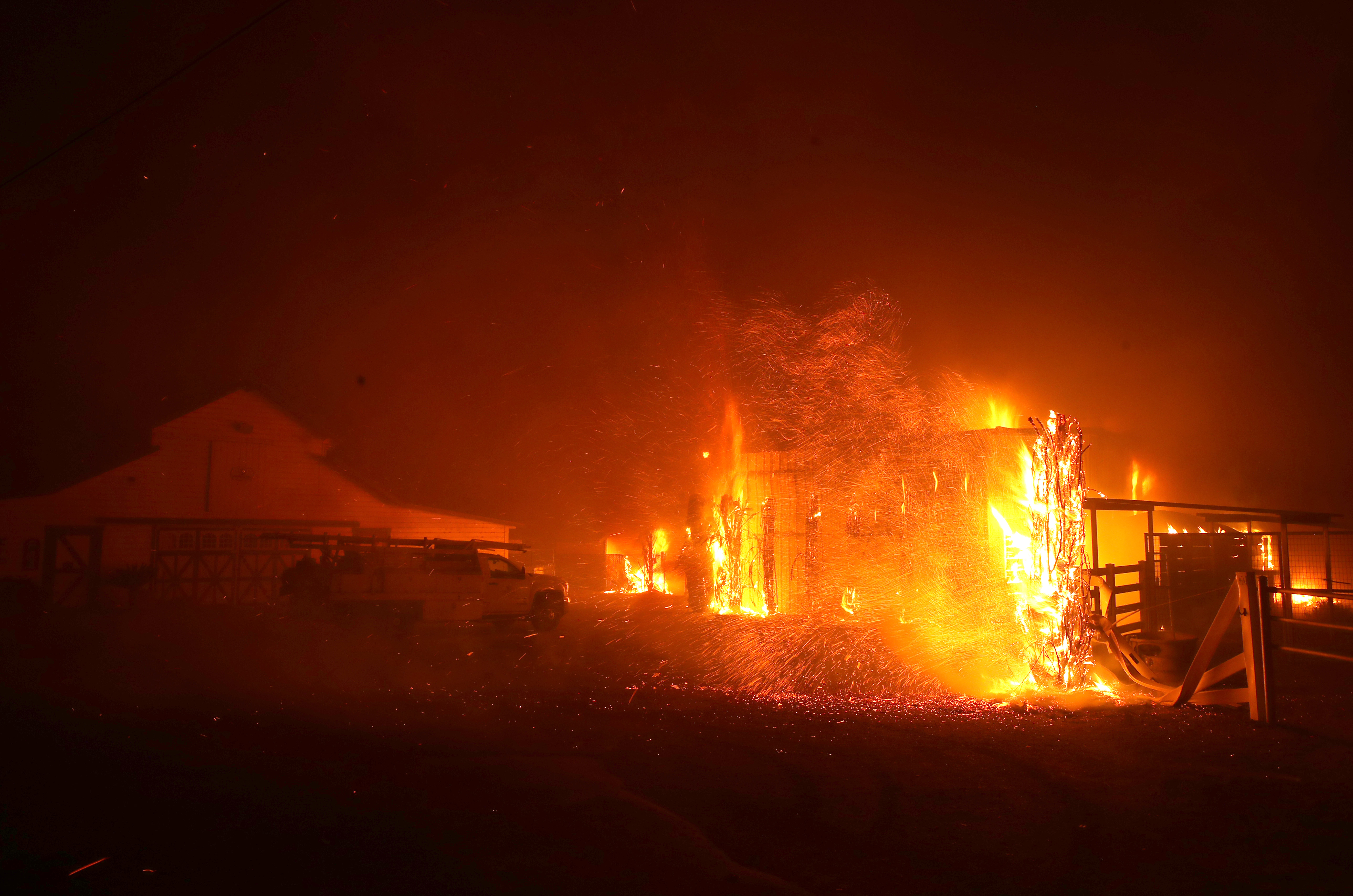 The Kincade Fire burns a structure on Oct. 27, 2019, in Santa Rosa, California. (Credit: Justin Sullivan/Getty Images)