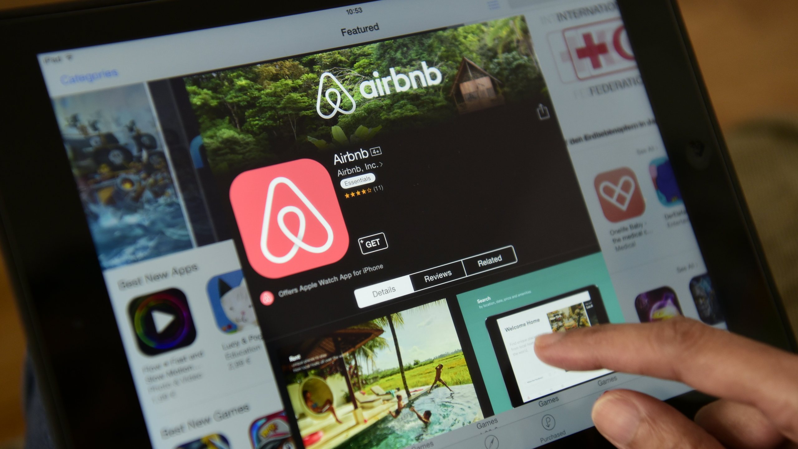 A woman browses Airbnb's website in Berlin on April 28, 2016. (Credit: John Macdougall/AFP via Getty Images)