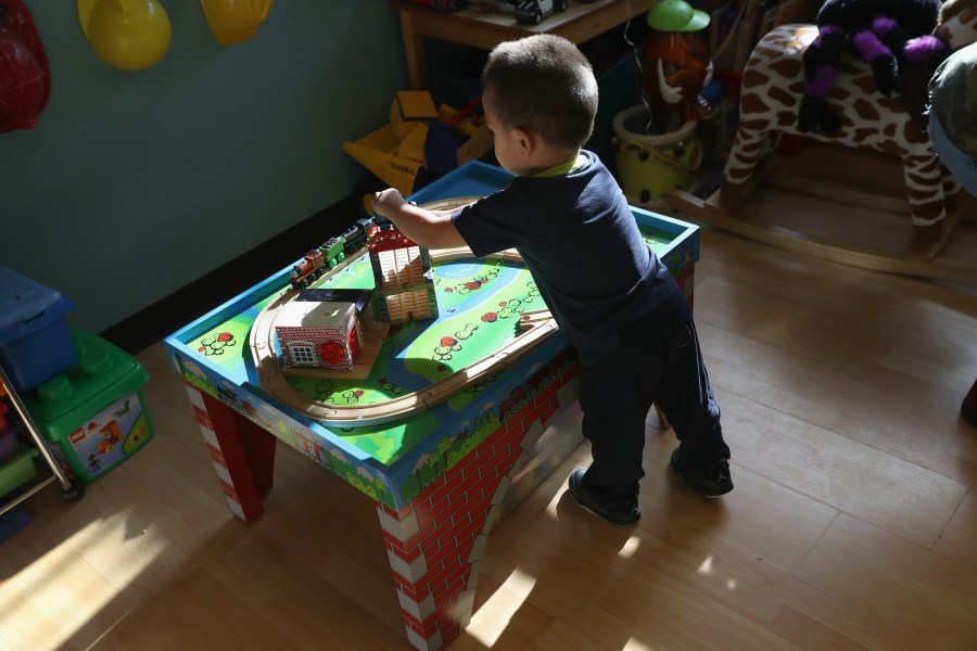 A boy plays in a childcare center as his mother takes part in a English-as-a-Second-Language (ESL), class on Dec. 3, 2016, at a migrants assistance center in Stamford, Conn. (Credit: John Moore/Getty Images)