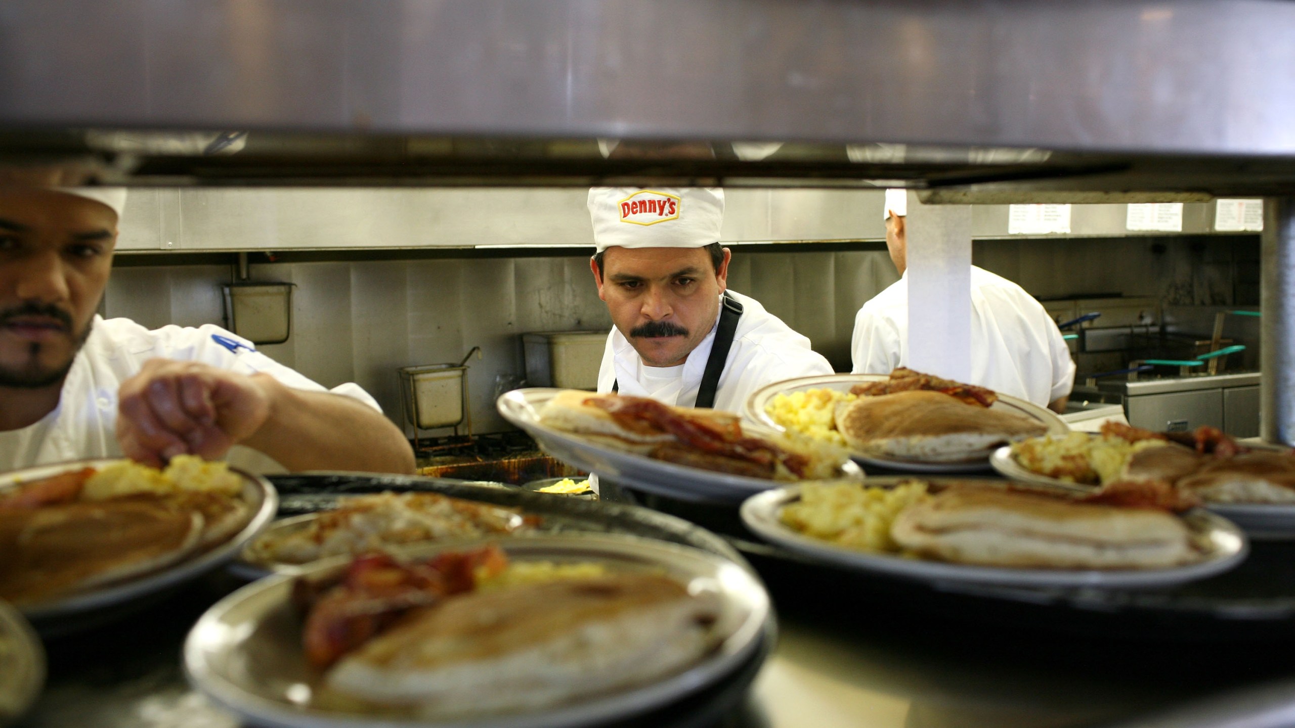 Denny's cooks prepare free Grand Slam breakfast plates February 3, 2009 in Emeryville, California. (Credit: Justin Sullivan/Getty Images)