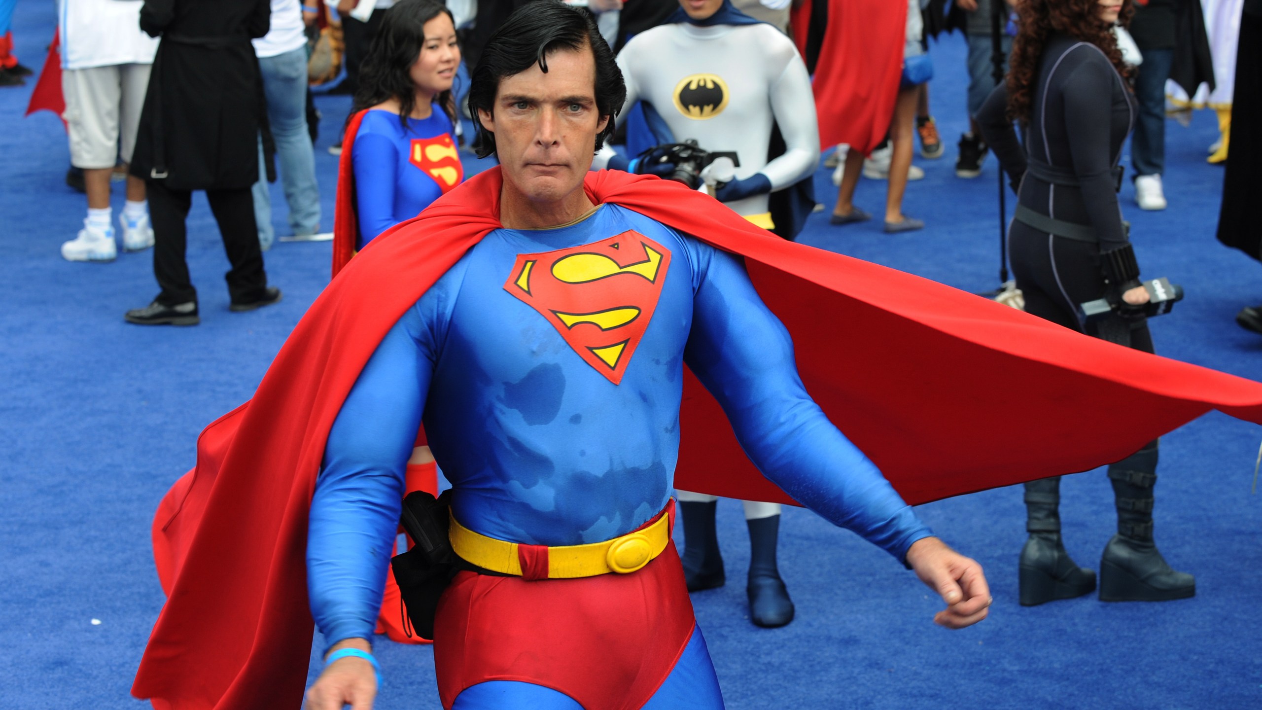 Christopher Dennis dressed as Superman joins the crowd of 1,580 costumed superheroes during the successful attempt to break the Guinness World Record for the largest gathering of superheroes outside the Staples Center in Los Angeles on Oct. 2, 2010. (Credit: Mark Ralston / AFP / Getty Images)