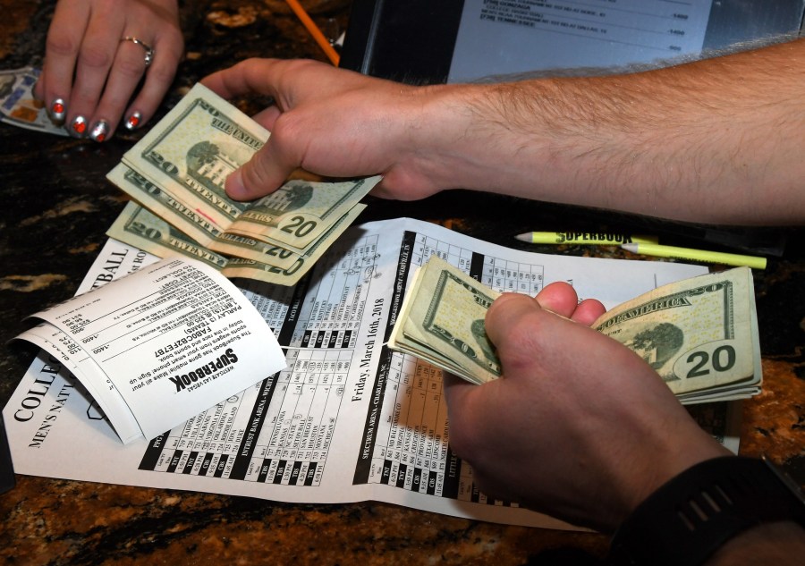 Jake Sindberg of Wisconsin makes bets during a viewing party for the NCAA Men's College Basketball Tournament inside the Westgate Las Vegas Resort & Casino in Las Vegas on March 15, 2018. (Credit: Ethan Miller / Getty Images)