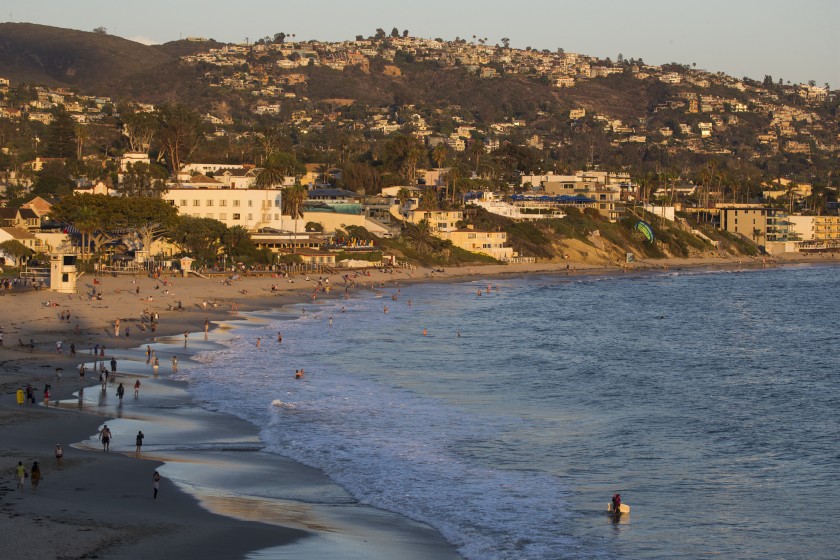 Beachgoers are seen at Laguna Beach in an undated photo. (Credit: Allen J. Schaben / Los Angeles Times)