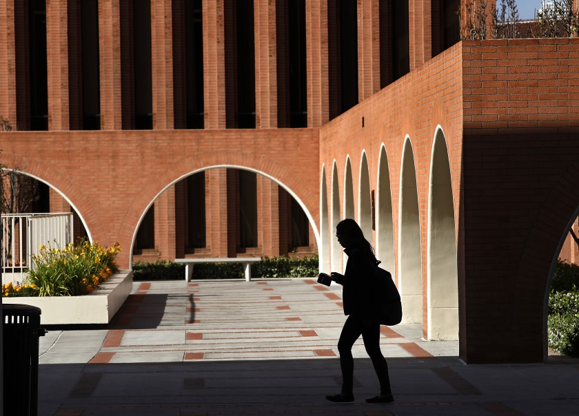 A student makes her way on the USC campus near the Barbara and Roger Rossier School of Education in this undated photo. (Mel Melcon/Los Angeles Times)