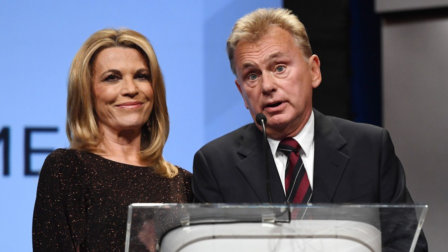 "Wheel of Fortune" hostess Vanna White (L) and host Pat Sajak speak as they are inducted into the National Association of Broadcasters Broadcasting Hall of Fame during the NAB Achievement in Broadcasting Dinner at the Encore Las Vegas on April 9, 2018 in Las Vegas, Nevada. (Credit: Ethan Miller/Getty Images)