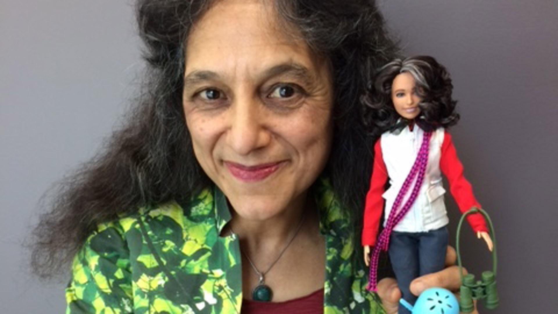 Nalini Nadkarni, a forest ecologist at the University of Utah, poses with her Barbie doppelgänger. (Credit: Nalini Nadkarni via University of Utah)