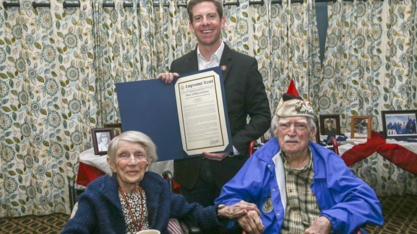 U.S. Rep. Mike Levin holds the congressional record recognizing married Marine veterans LaVonne “Bea” Walsh, 95, and Joe Walsh, 100, on Joe’s 100th birthday in March.(Credit: U.S. Marine Corps via Los Angeles Times)