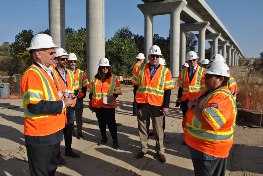 Officials lead a tour of several construction sites on California's high-speed rail project in Fresno on Nov. 6, 2019. (Credit: California High-Speed Rail Authority)