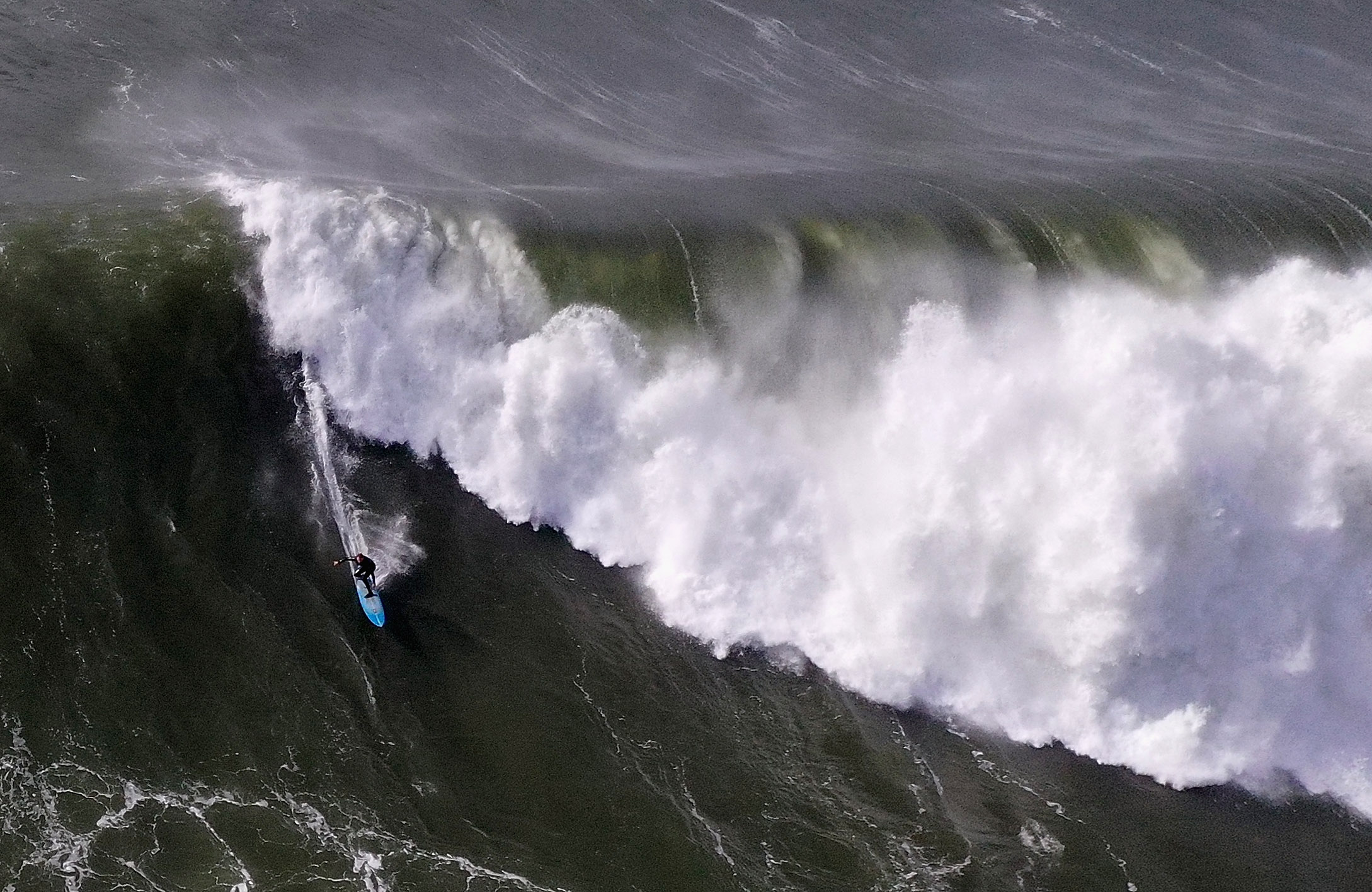 A surfer rides a giant wave at Mavericks on Dec. 17, 2018, in Half Moon Bay. (Credit: Ezra Shaw/Getty Images)