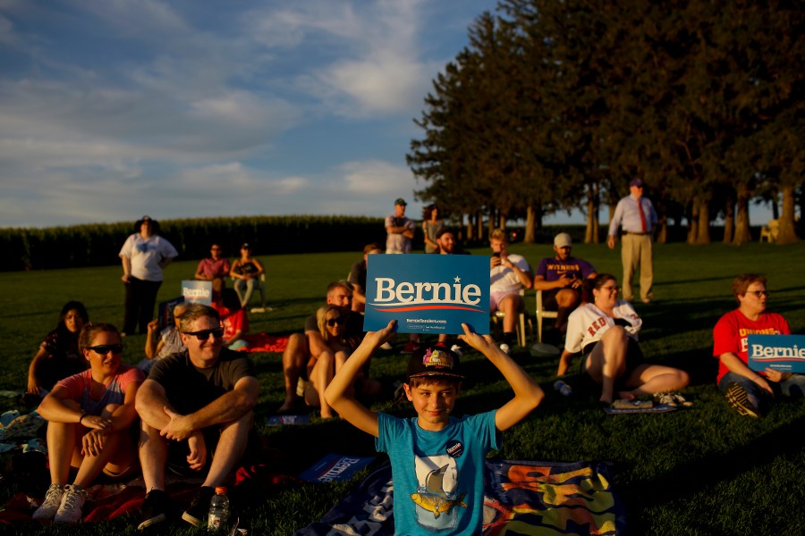 People attend Democratic presidential candidate Sen. Bernie Sanders' baseball game on Aug. 19, 2019 (Credit: Joshua Lott/Getty)