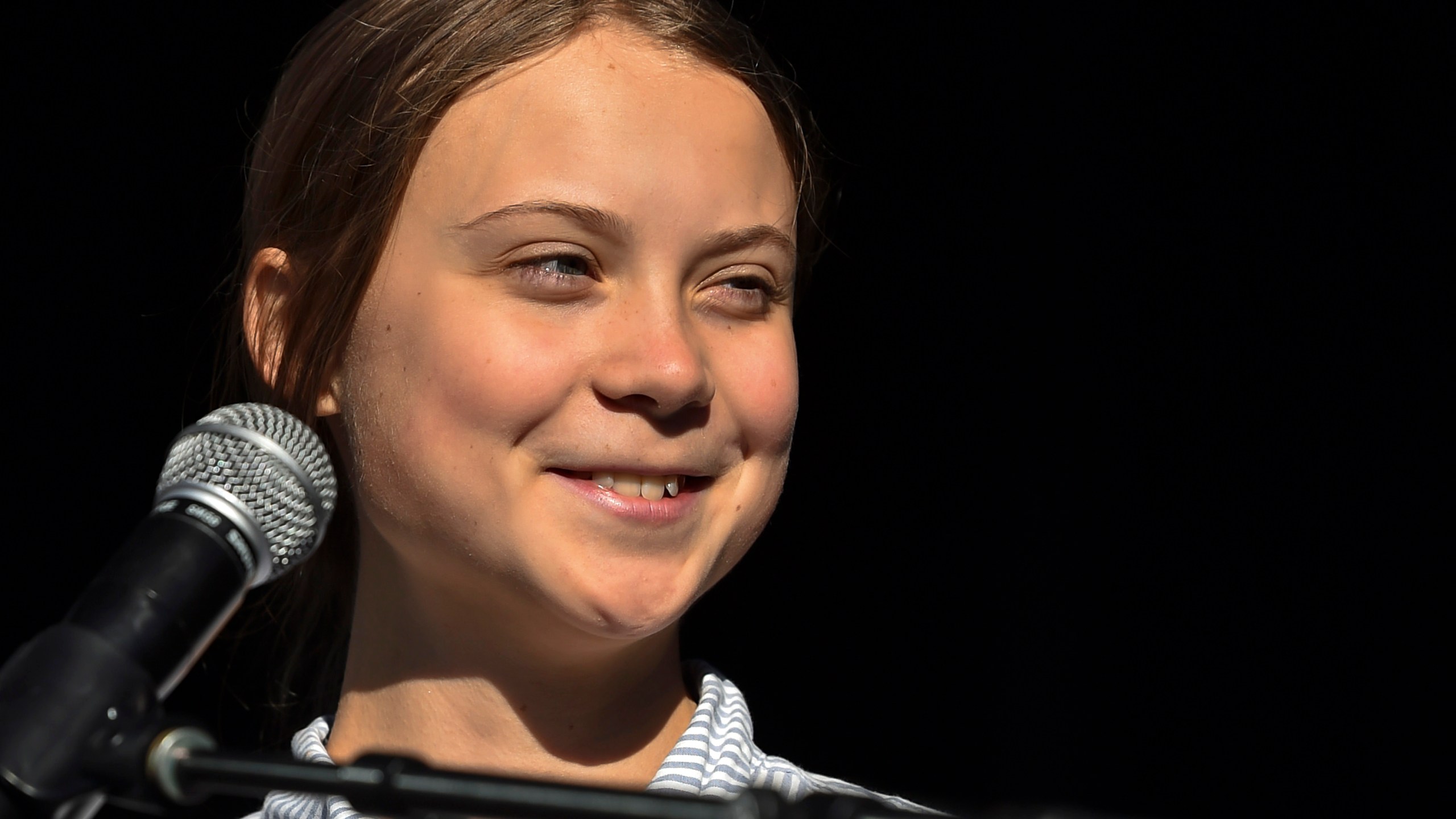 Swedish climate activist Greta Thunberg takes to the podium to address young activists and their supporters during the rally for action on climate change on September 27, 2019 in Montreal, Canada. (Credit: Minas Panagiotakis/Getty Images)