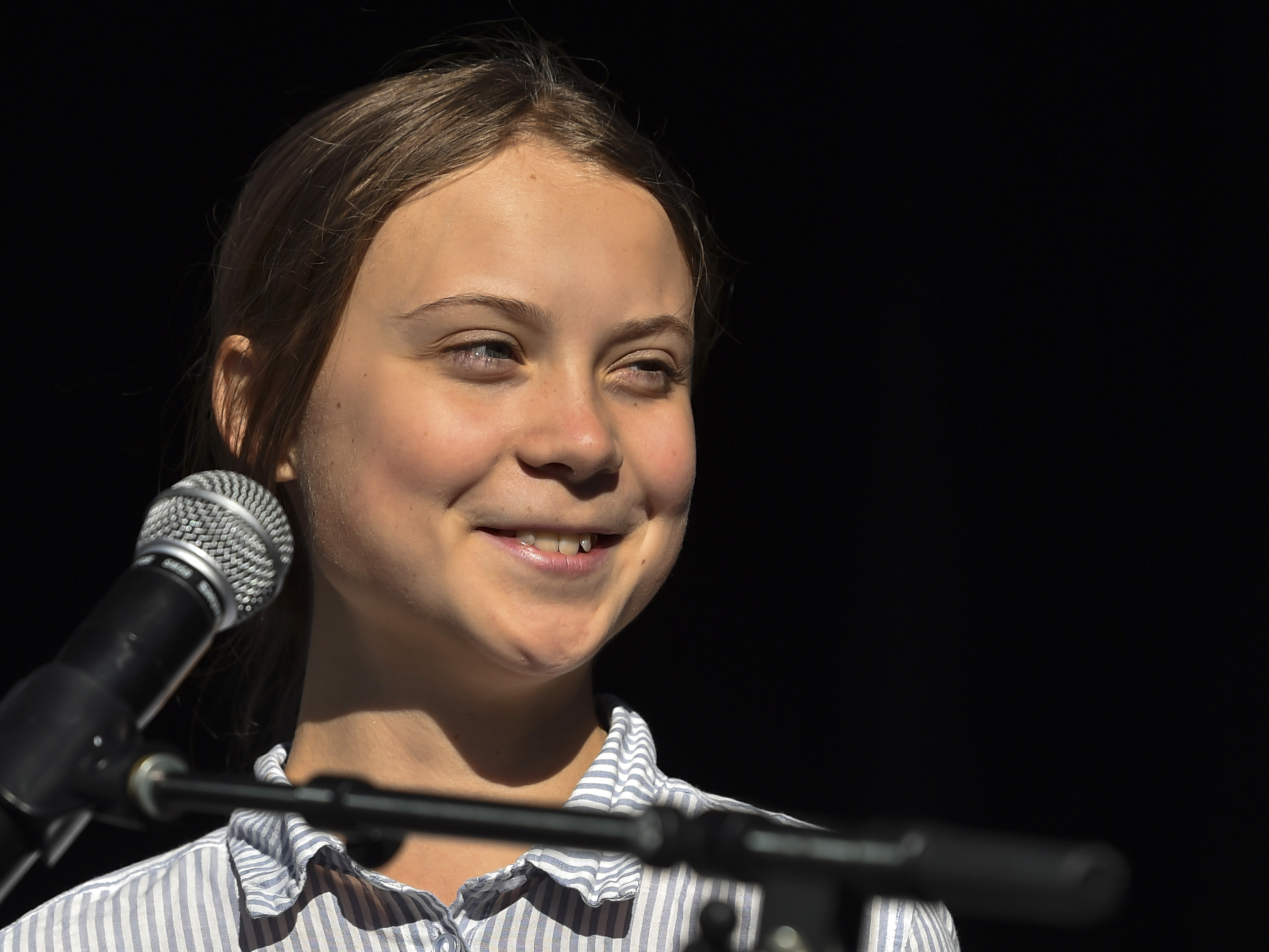 Swedish climate activist Greta Thunberg takes to the podium to address young activists and their supporters during the rally for action on climate change on September 27, 2019 in Montreal, Canada. (Credit: Minas Panagiotakis/Getty Images)