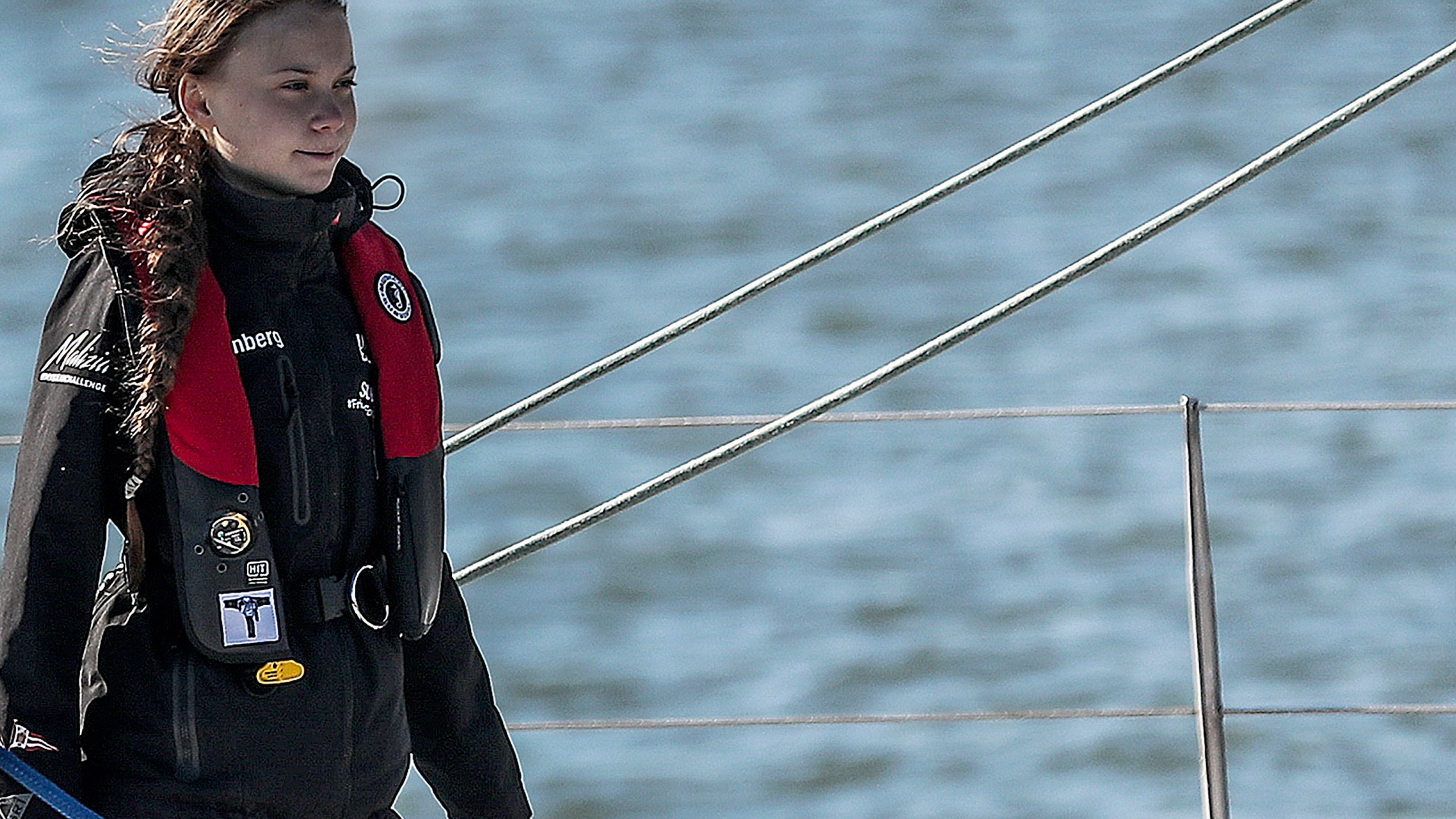 Swedish climate activist Greta Thunberg arrives at the Santo Amaro docks in Lisbon onboard the catamaran La Vagabonde, on Dec. 3, 2019.(Credit: CARLOS COSTA/AFP via Getty Images)