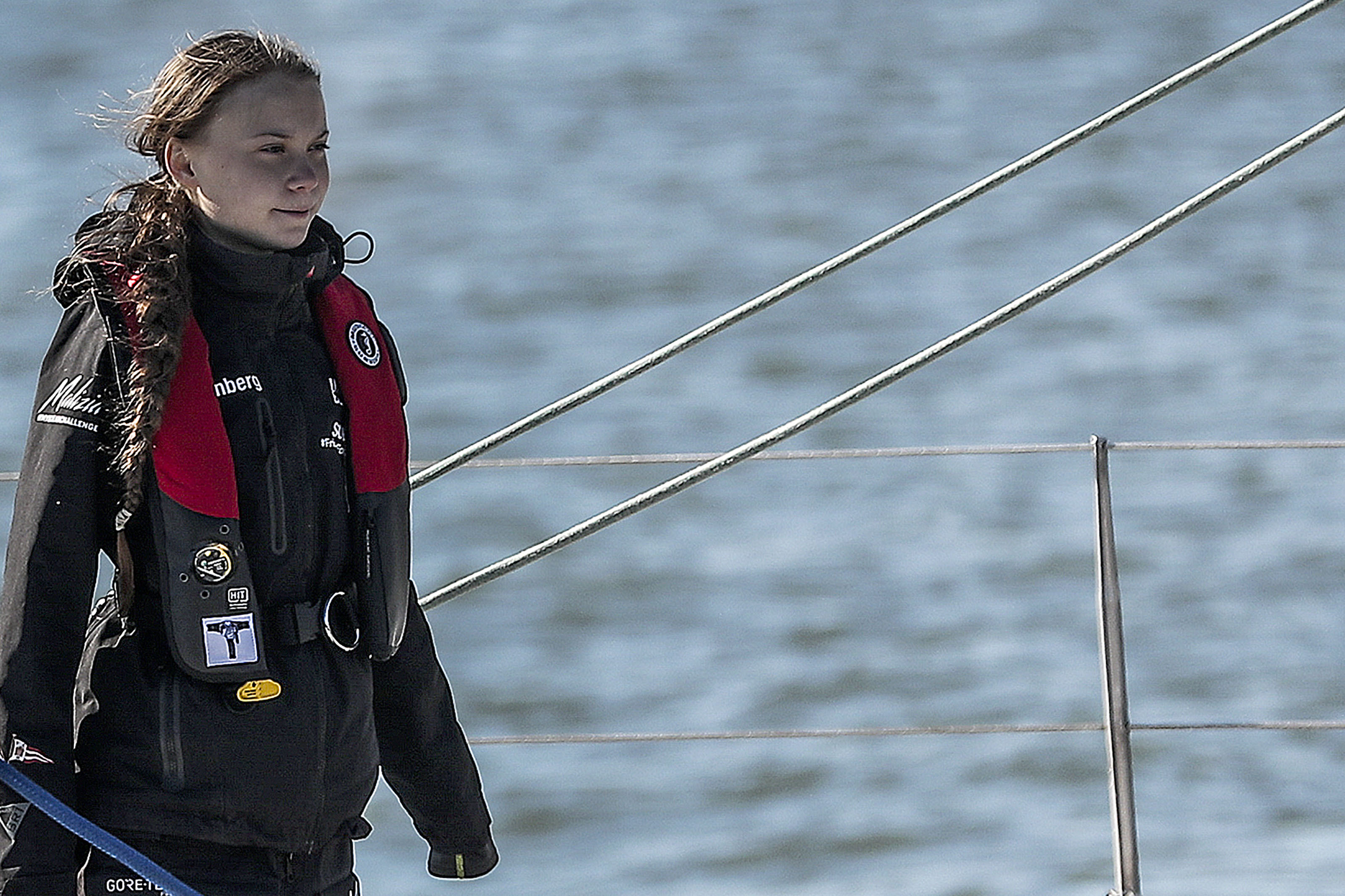 Swedish climate activist Greta Thunberg arrives at the Santo Amaro docks in Lisbon onboard the catamaran La Vagabonde, on Dec. 3, 2019.(Credit: CARLOS COSTA/AFP via Getty Images)