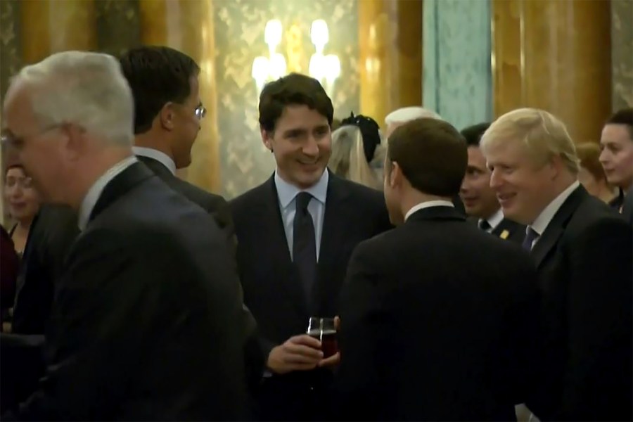 This screenshot from a video shows Dutch Prime Minister Mark Rutte, left, French President Emmanuel Macron, front, British Prime Minister Boris Johnson, right, and Canada's Prime Minister Justin Trudeau, back center, as the leaders of Britain, Canada, France and the Netherlands were caught on camera at a Buckingham Palace reception talking about President Donald Trump's lengthy media appearances ahead of the NATO summit on Dec. 3, 2019 in London. (Credit: NATO TV/AFP via Getty Images)