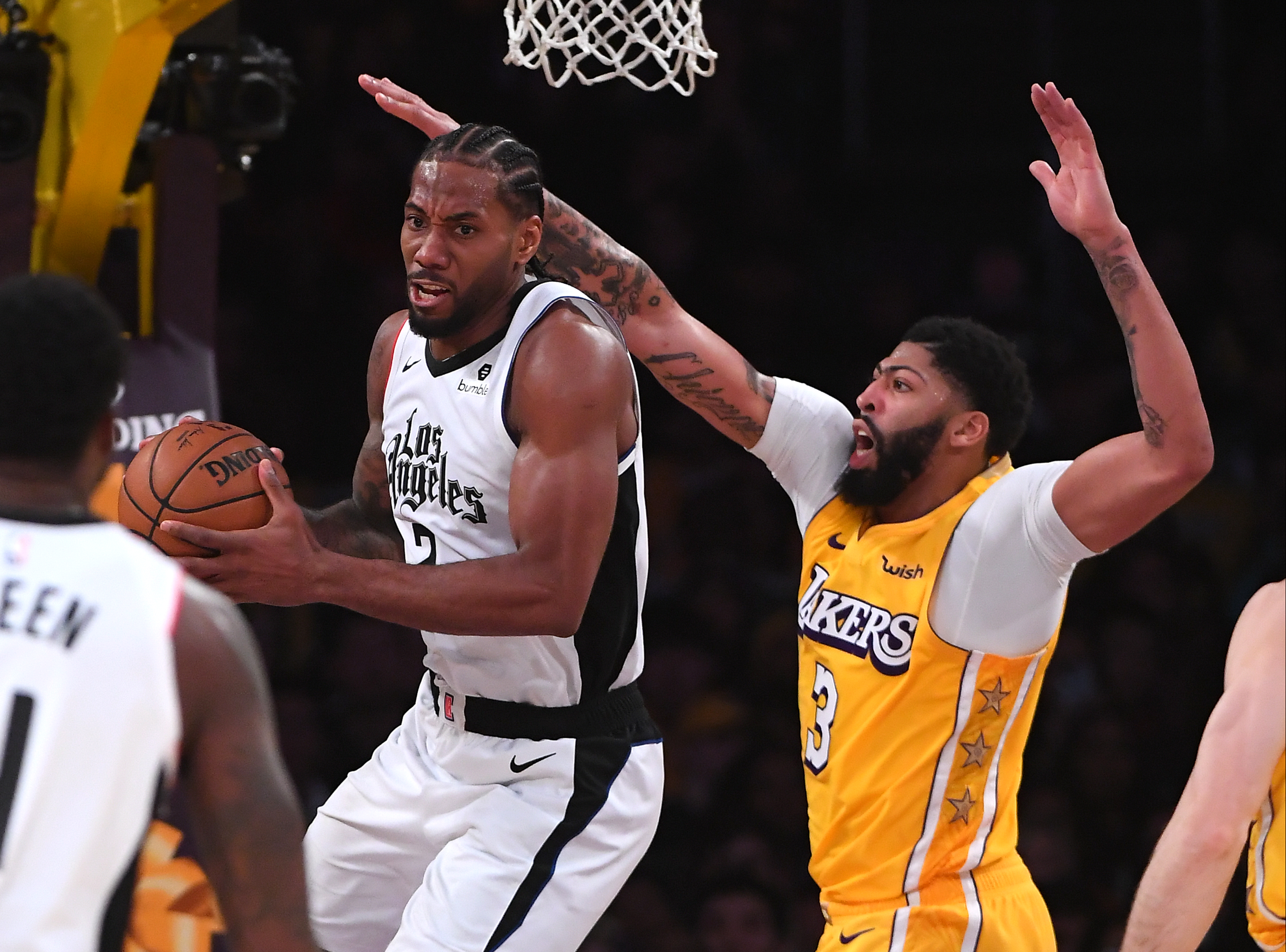 Anthony Davis #3 of the Los Angeles Lakers defends guards Kawhi Leonard #2 of the Los Angeles Clippers as he makes a pass under the basket in the second half of the game at Staples Center on Dec. 25, 2019. (Credit: Jayne Kamin-Oncea/Getty Images)