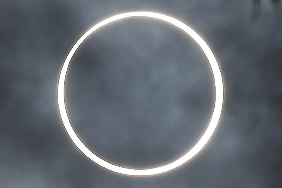 The moon totally covers the sun in a rare "ring of fire" solar eclipse as seen from the south Indian city of Dindigul in Tamil Nadu state on Dec. 26, 2019. (Credit: ARUN SANKAR/AFP via Getty Images)