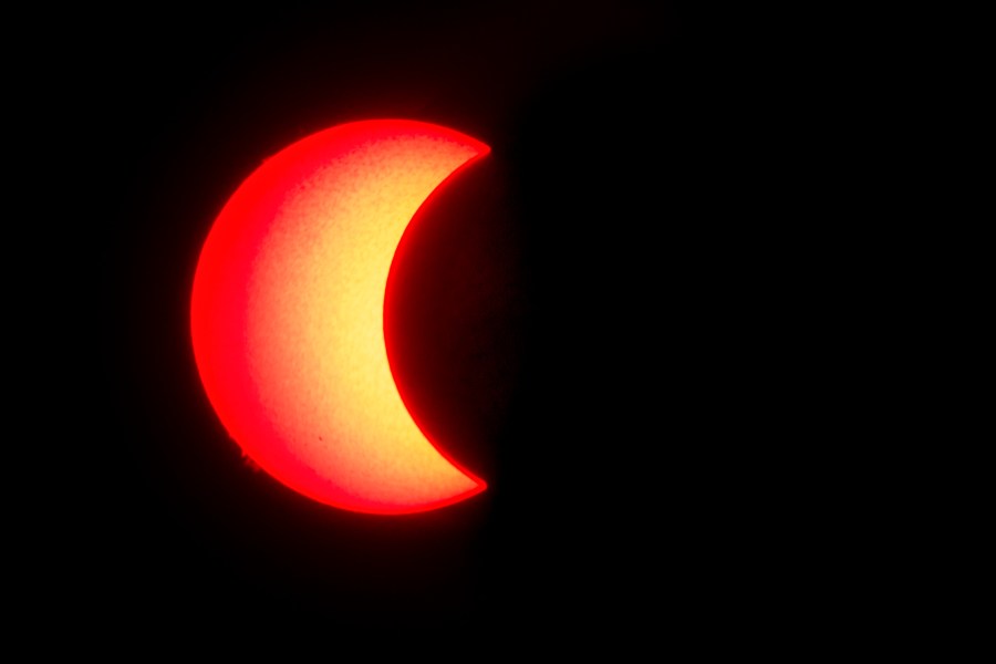 The surface of the sun is seen as the moon moves in front of it in a rare "ring of fire" solar eclipse, as seen from Wan Twin in central Myanmar on Dec. 26, 2019. (Credit: YE AUNG THU/AFP via Getty Images)