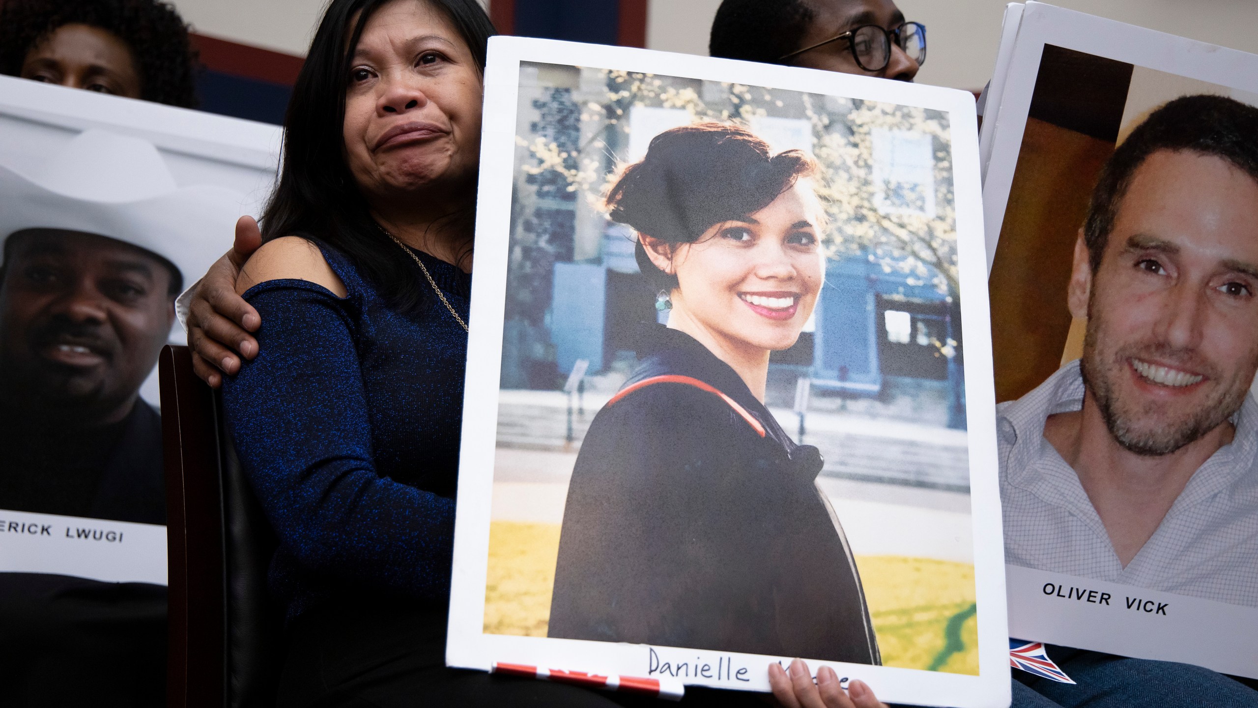 Clariss Moore, mom of Danielle Moore who was killed in a Boeing 737 crash listens to FAA administrator Stephen M. Dickson before an Oversight Committee hearing on Dec. 11, 2019. (Credit: Tasos Katopodis/Getty Images)