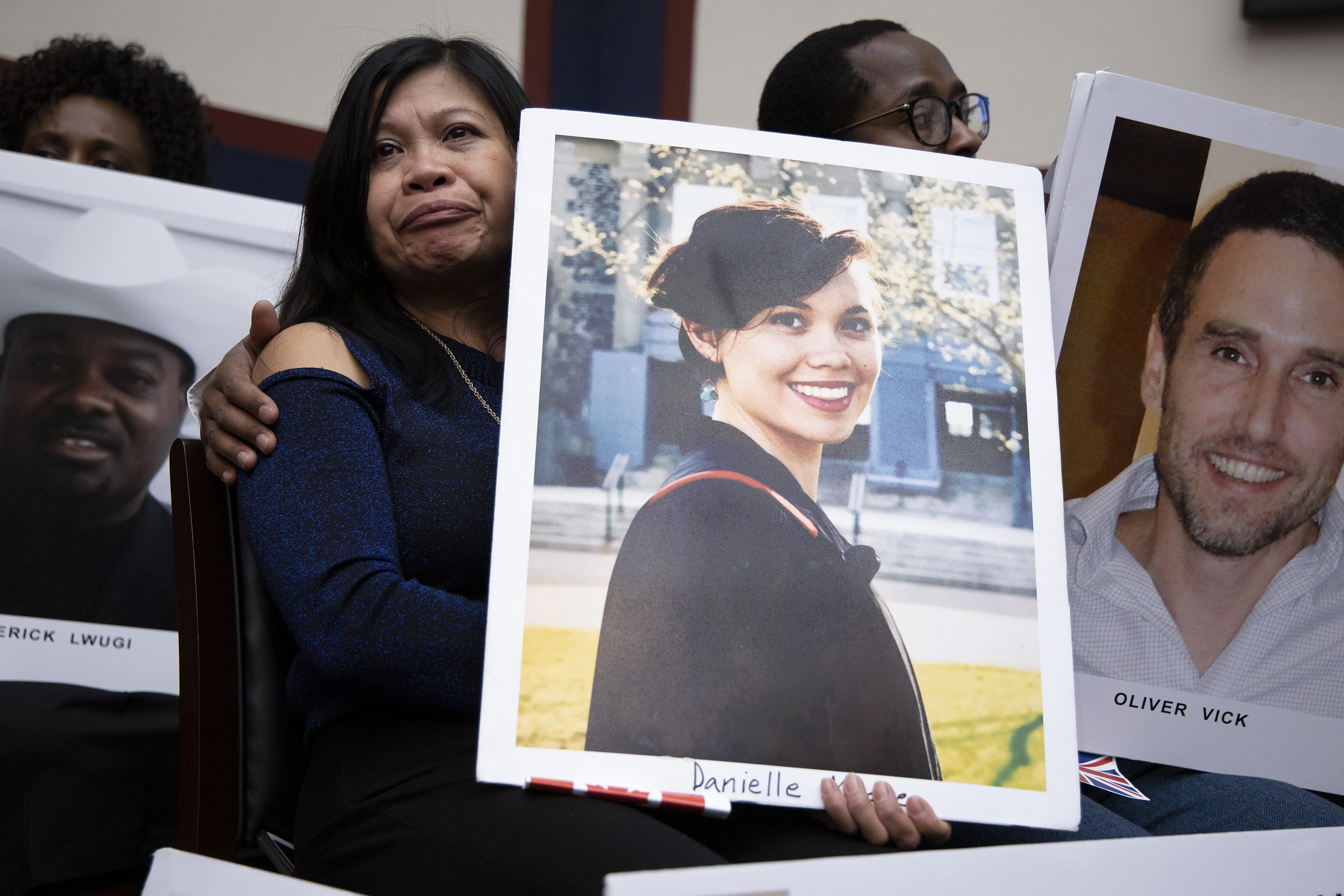 Clariss Moore, mom of Danielle Moore who was killed in a Boeing 737 crash listens to FAA administrator Stephen M. Dickson before an Oversight Committee hearing on Dec. 11, 2019. (Credit: Tasos Katopodis/Getty Images)