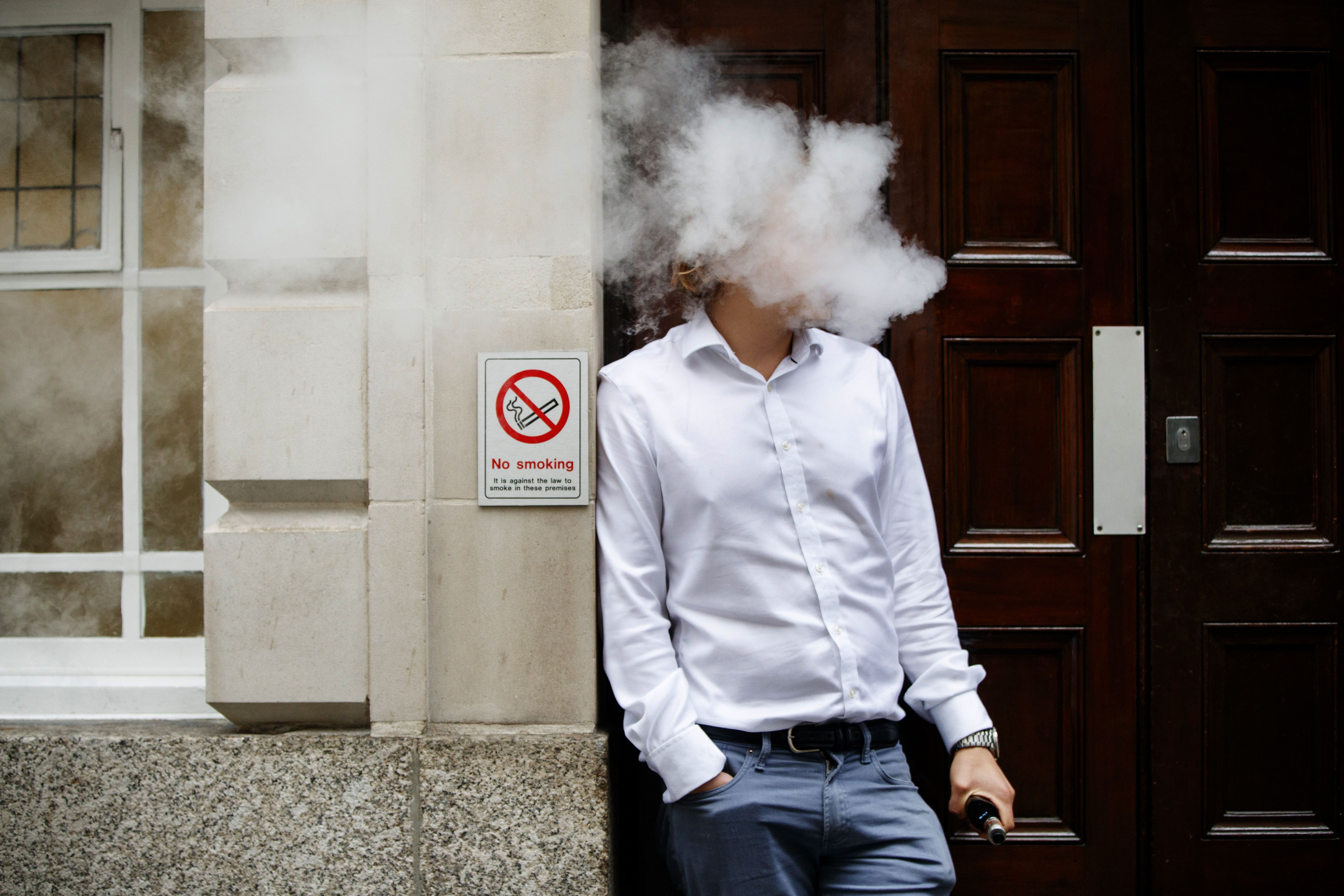 A man vapes in central London on Aug. 9, 2017. (Credit: Tolga Akmen/AFP via Getty Images)