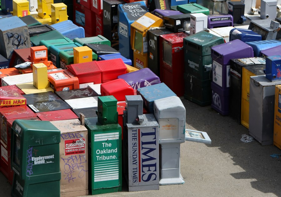 An assortment of newspaper and magazine vending racks sit in an empty lot March 18, 2009 in San Francisco. (Credit: Justin Sullivan/Getty Images)