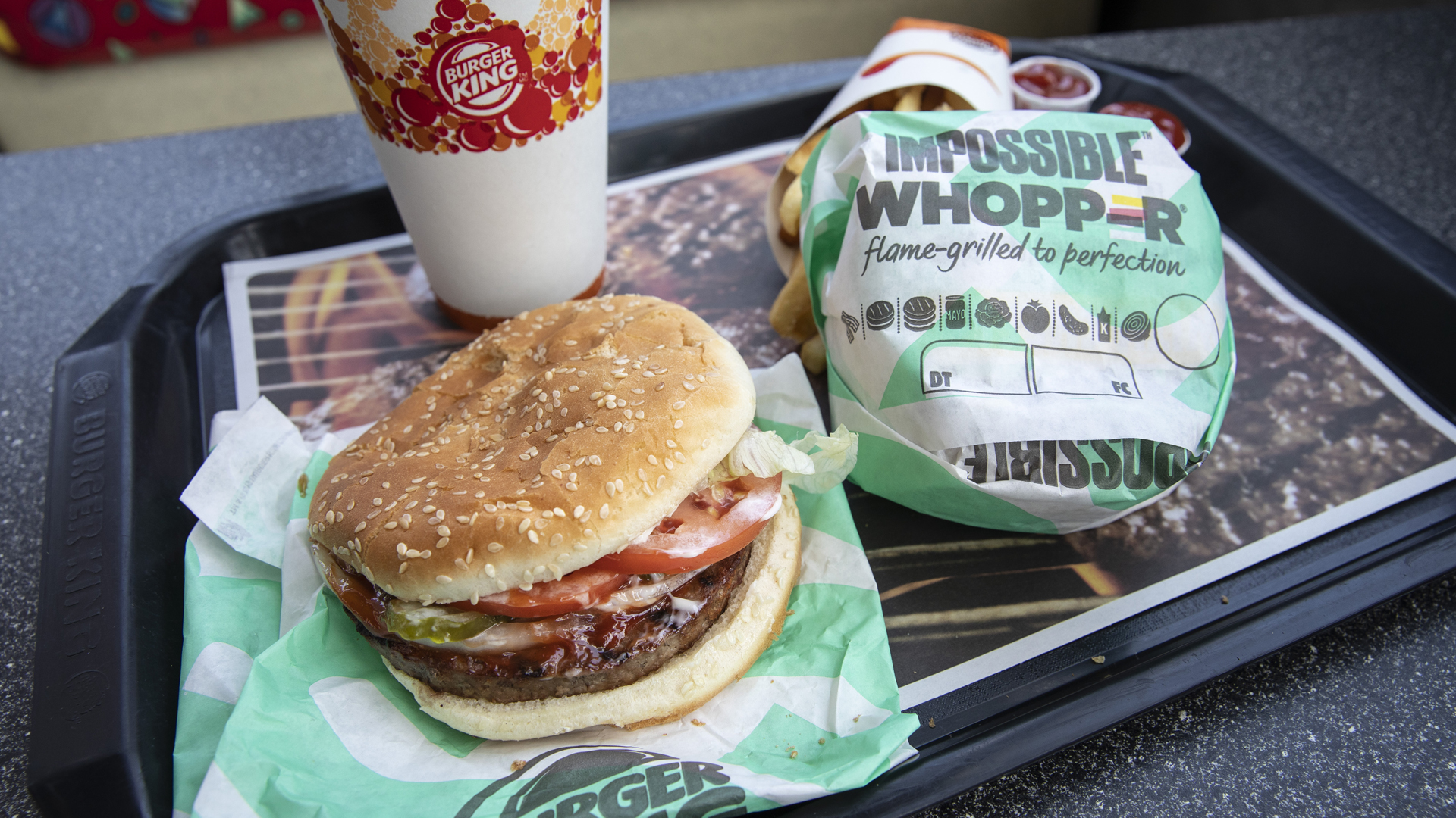 In this photo illustration, the new Impossible Whopper sits on a table at a Burger King restaurant on August 8, 2019, in Brooklyn, New York. (Credit: Drew Angerer/Getty Images)