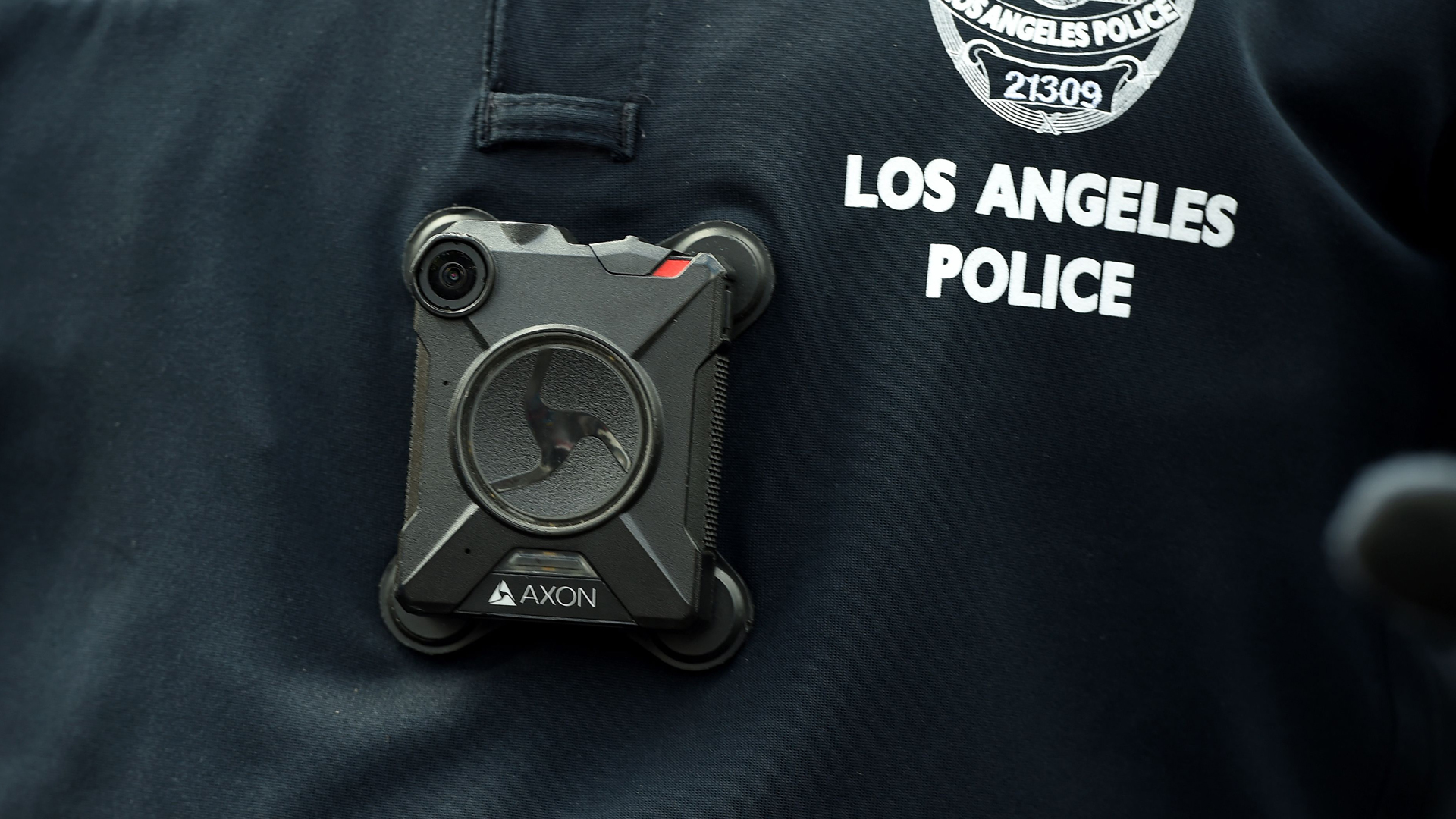 An LAPD officer wears a body camera at the Los Angeles Gay Pride Resist March, June 11, 2017, in Hollywood (Credit: ROBYN BECK/AFP via Getty Images)