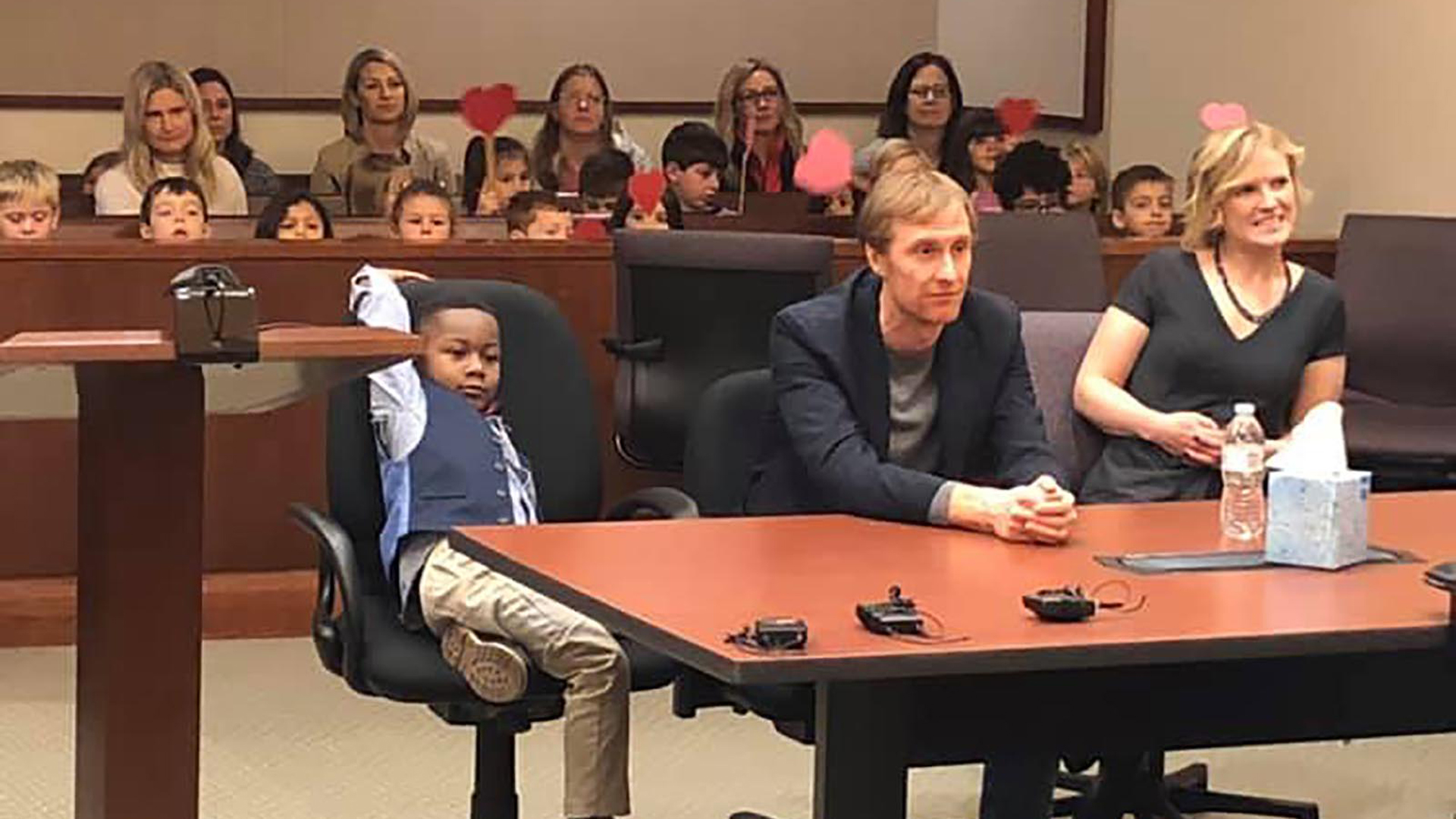 Five-year-old Michael's entire kindergarten class sat in the audience behind him waving big red hearts mounted on wooden sticks to show their support. (Credit: Kent County, Michigan)