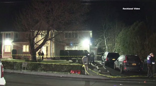 Caution tape surrounds a Monsey, New York home where a stabbing happened during a Hanukkah celebration on Dec. 28, 2019. (Credit: Rockland Video via CNN)