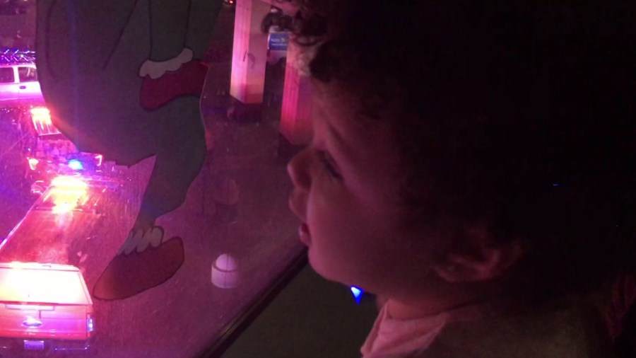 A patient at Shriners Hospitals for Children in Sacramento watches a light show produced by local police and firefighters on Dec. 17, 2019. (Credit: KTXL)